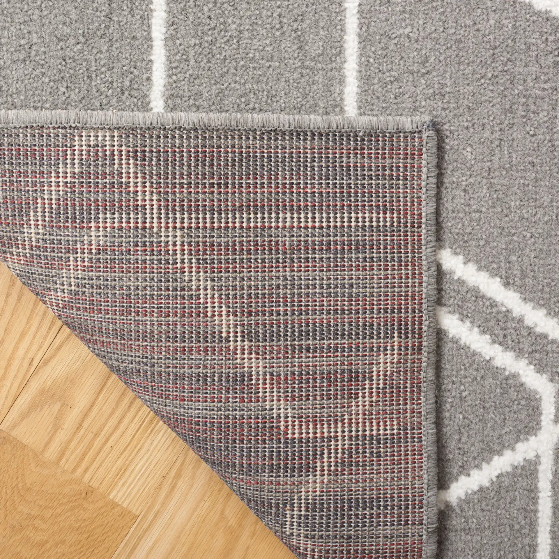Pyramid Interlocking Cube Rug in Gray / Ivory in a styled room
