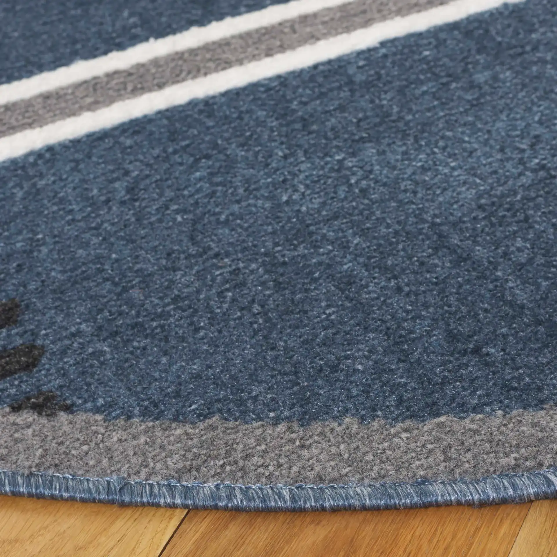 Pyramid Modern Striped Rug in Navy / Gray Black in a styled room