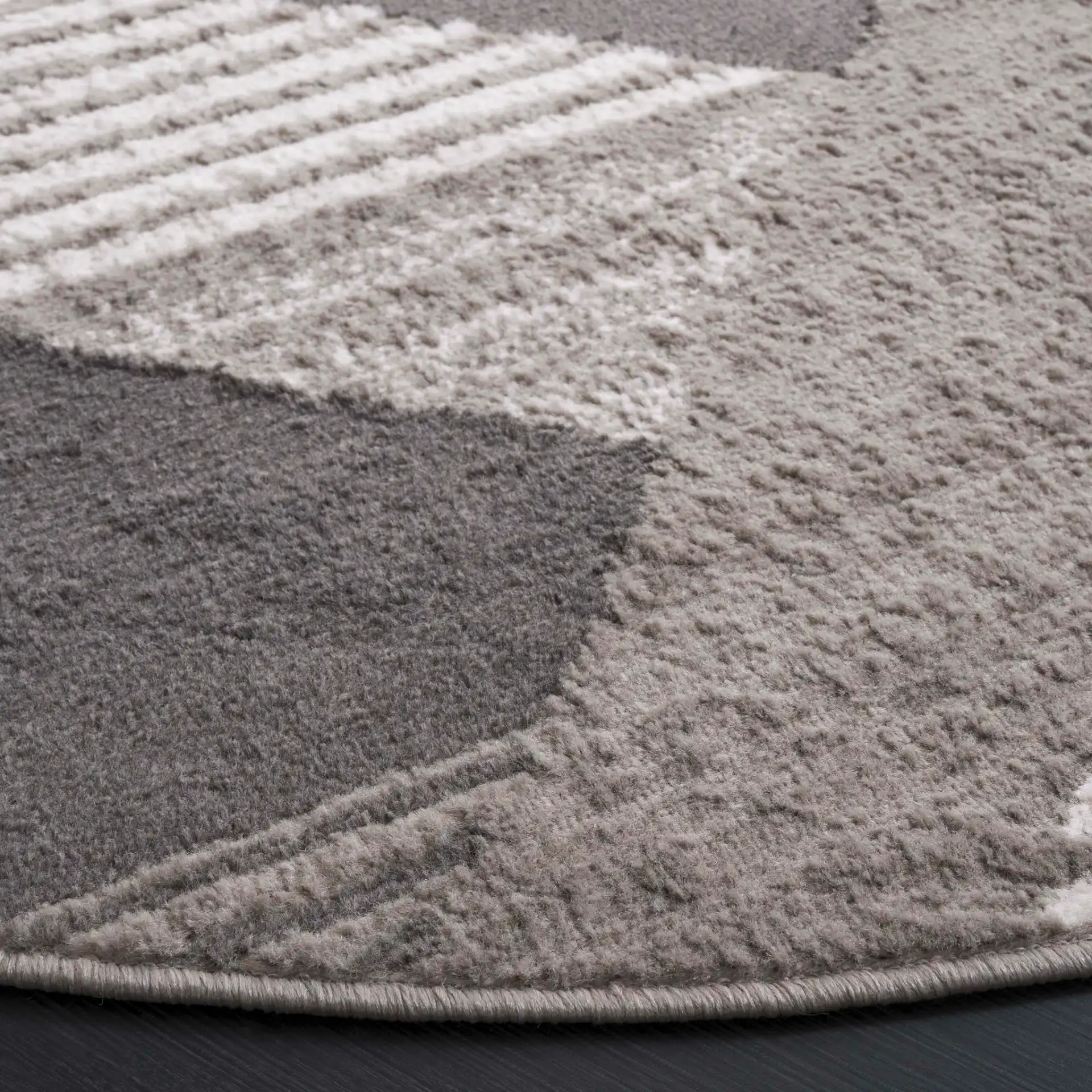 Pyramid Modern Geometric Rug in Gray / Ivory in a styled room