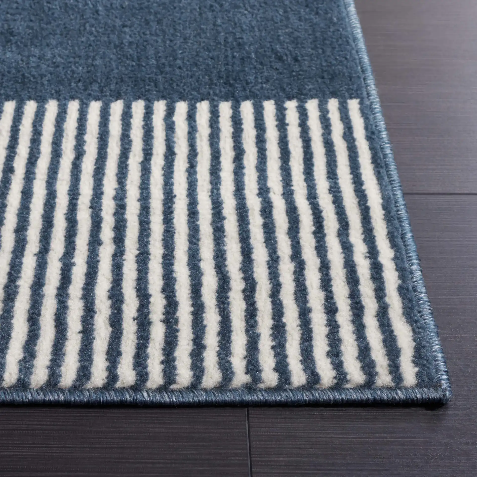 Pyramid Striped Rug in Navy / Ivory in a styled room