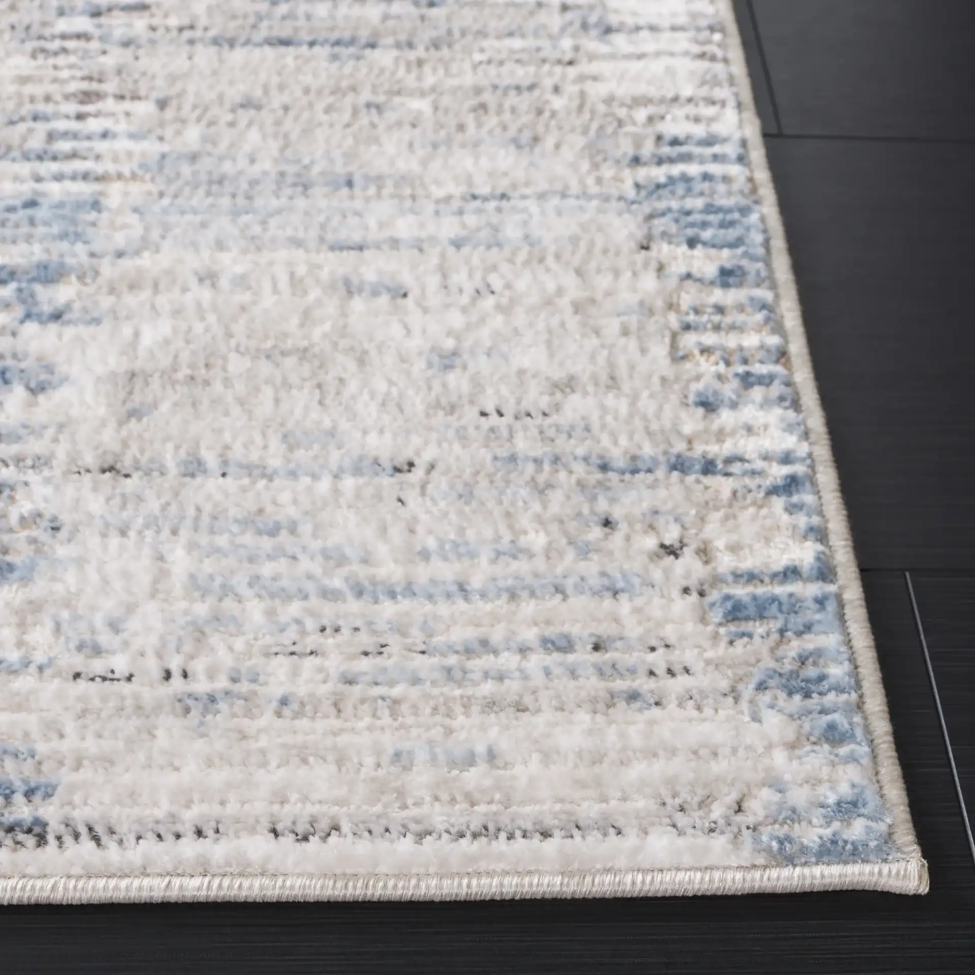 Quincy Faded Column Rug in Ivory / Light Gray in a styled room