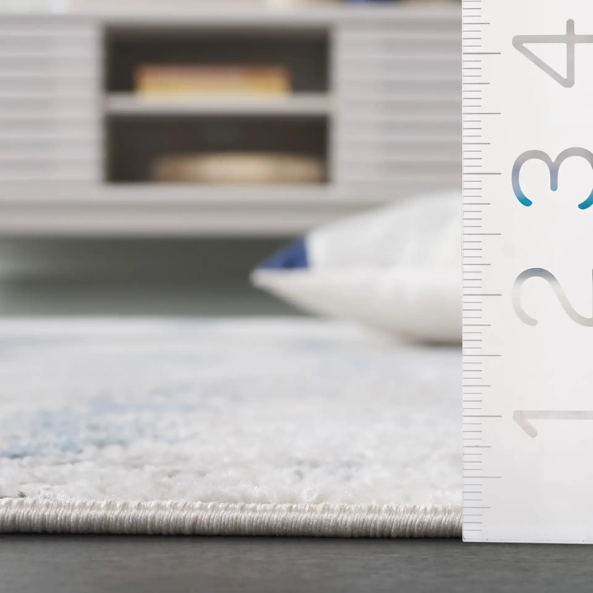 Quincy Faded Column Rug in Ivory / Light Gray in a styled room