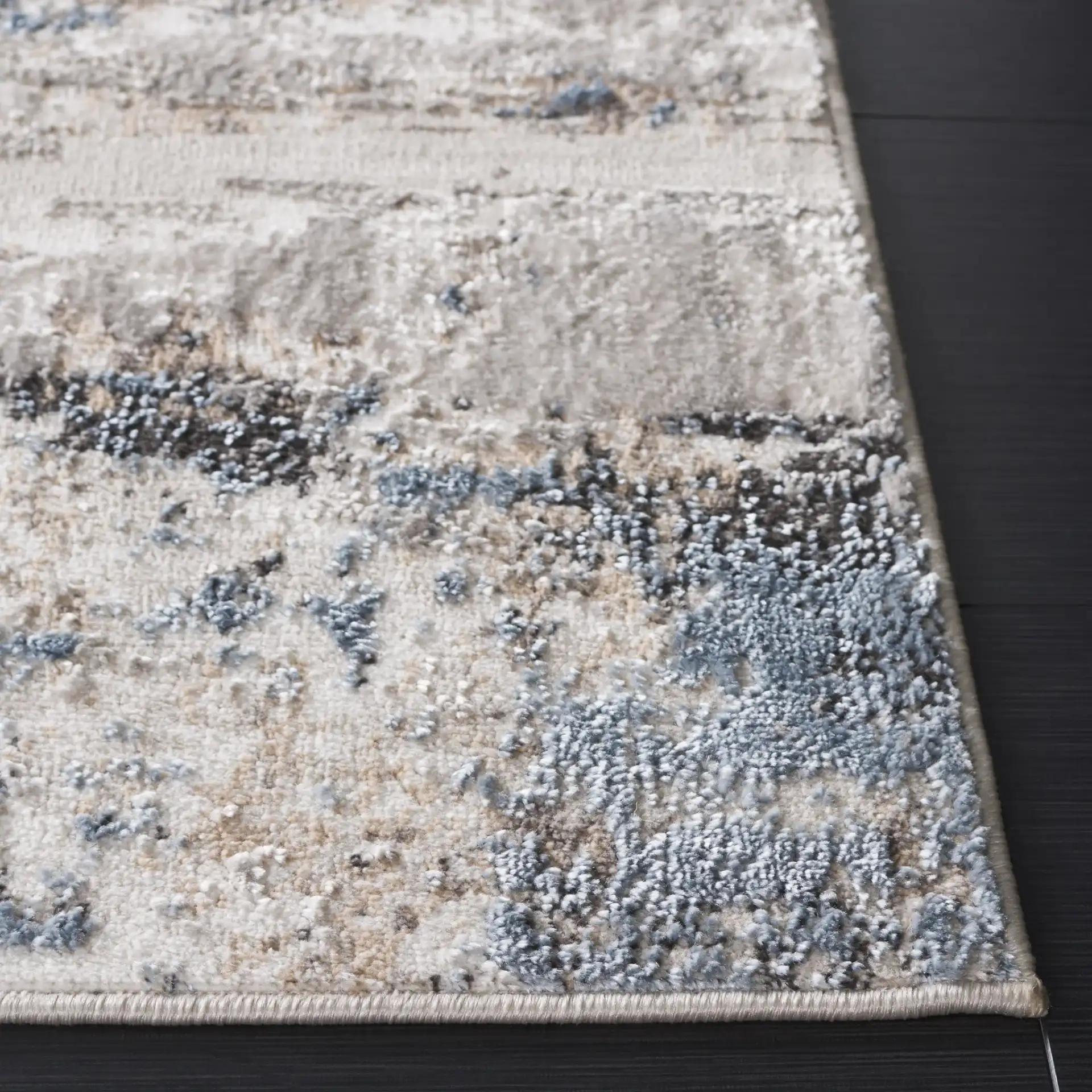 Quincy Abstract Rug in Ivory / Blue in a styled room