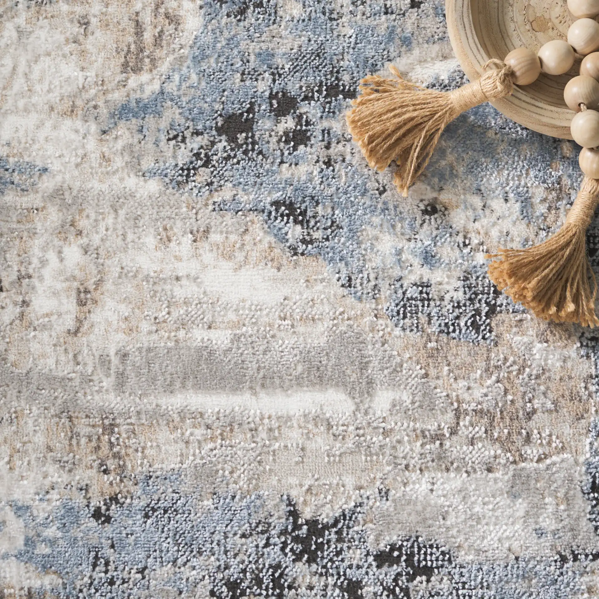 Quincy Abstract Rug in Ivory / Blue in a styled room