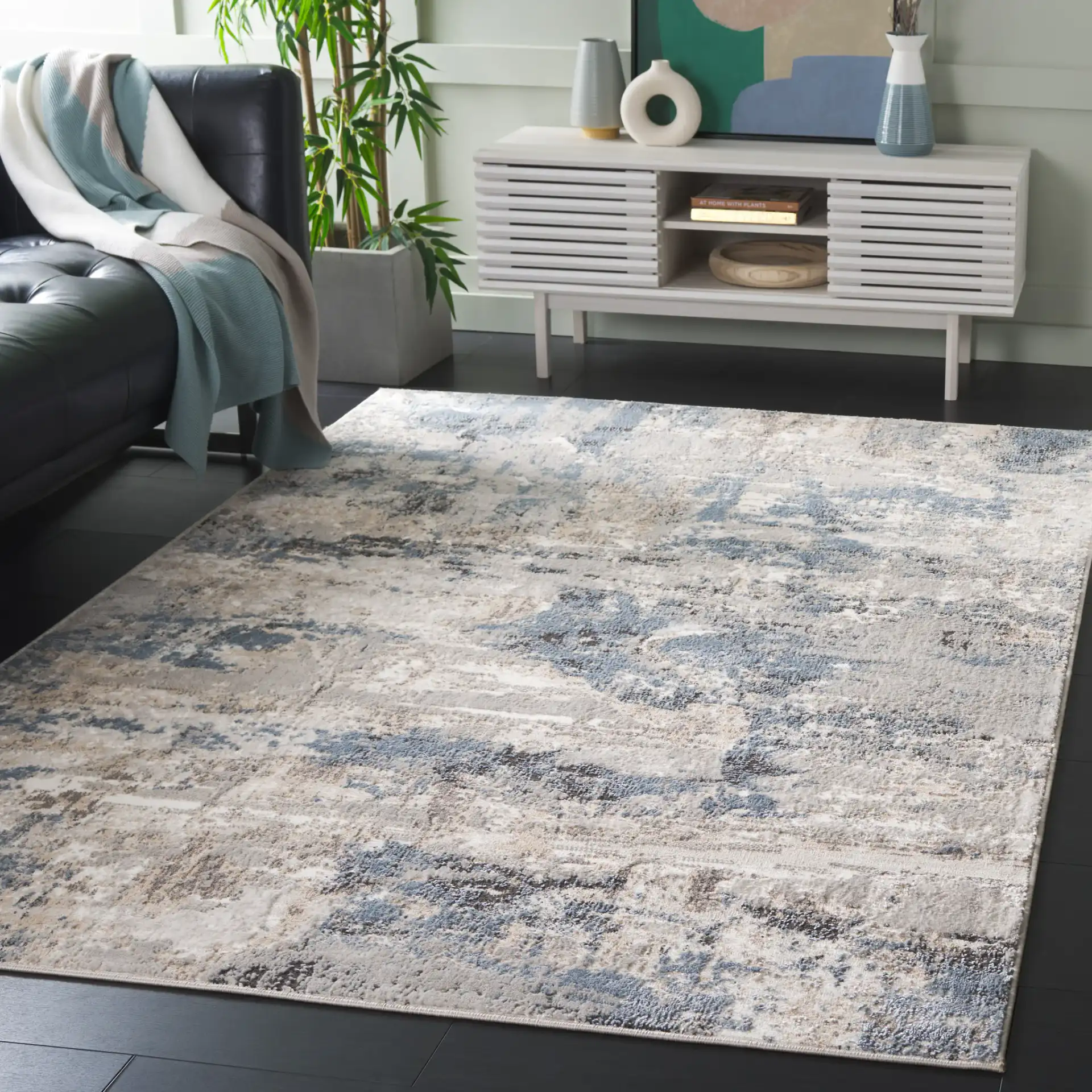 Quincy Abstract Rug in Ivory / Blue in a styled room
