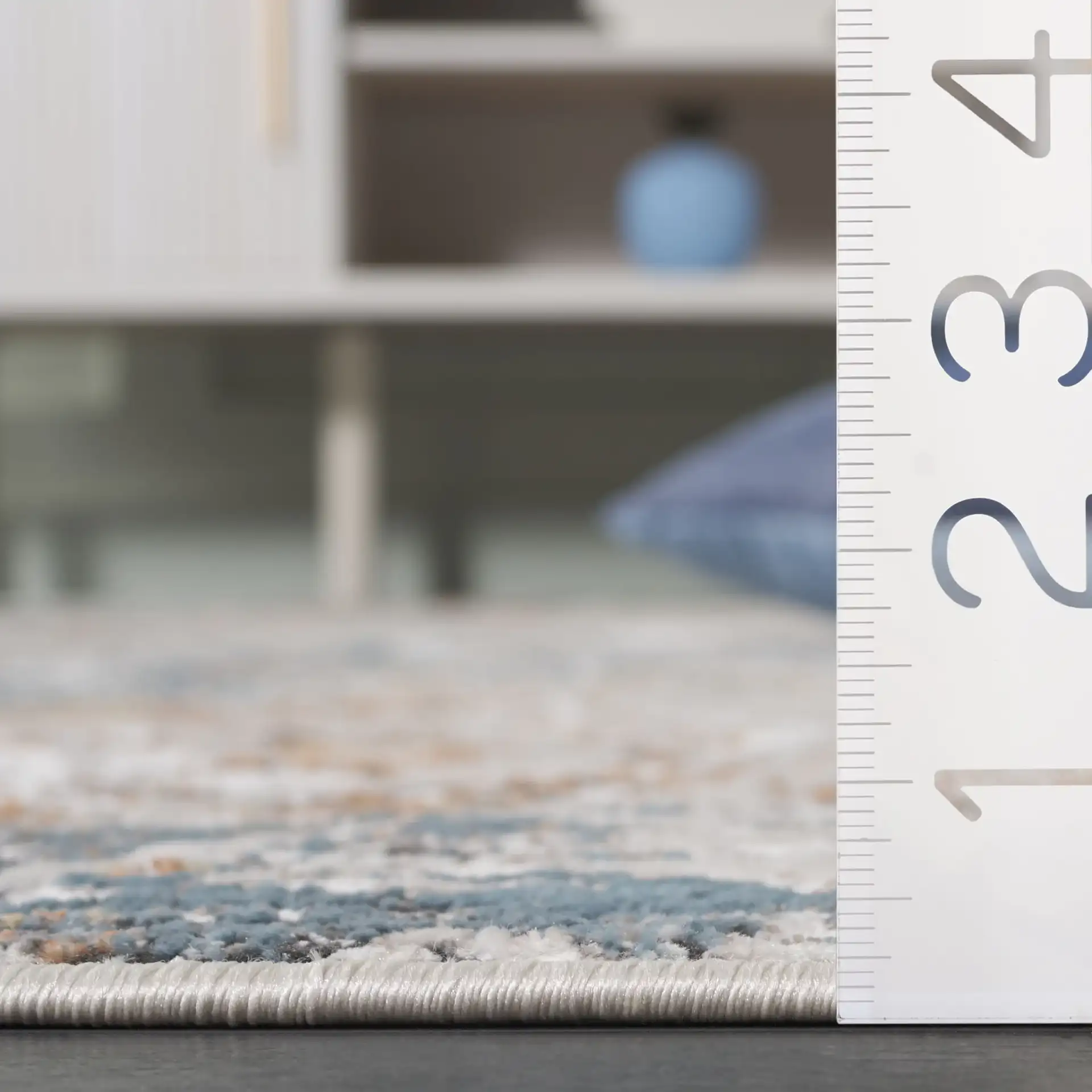 Rana Abstract Marble Rug in Ivory / Beige in a styled room