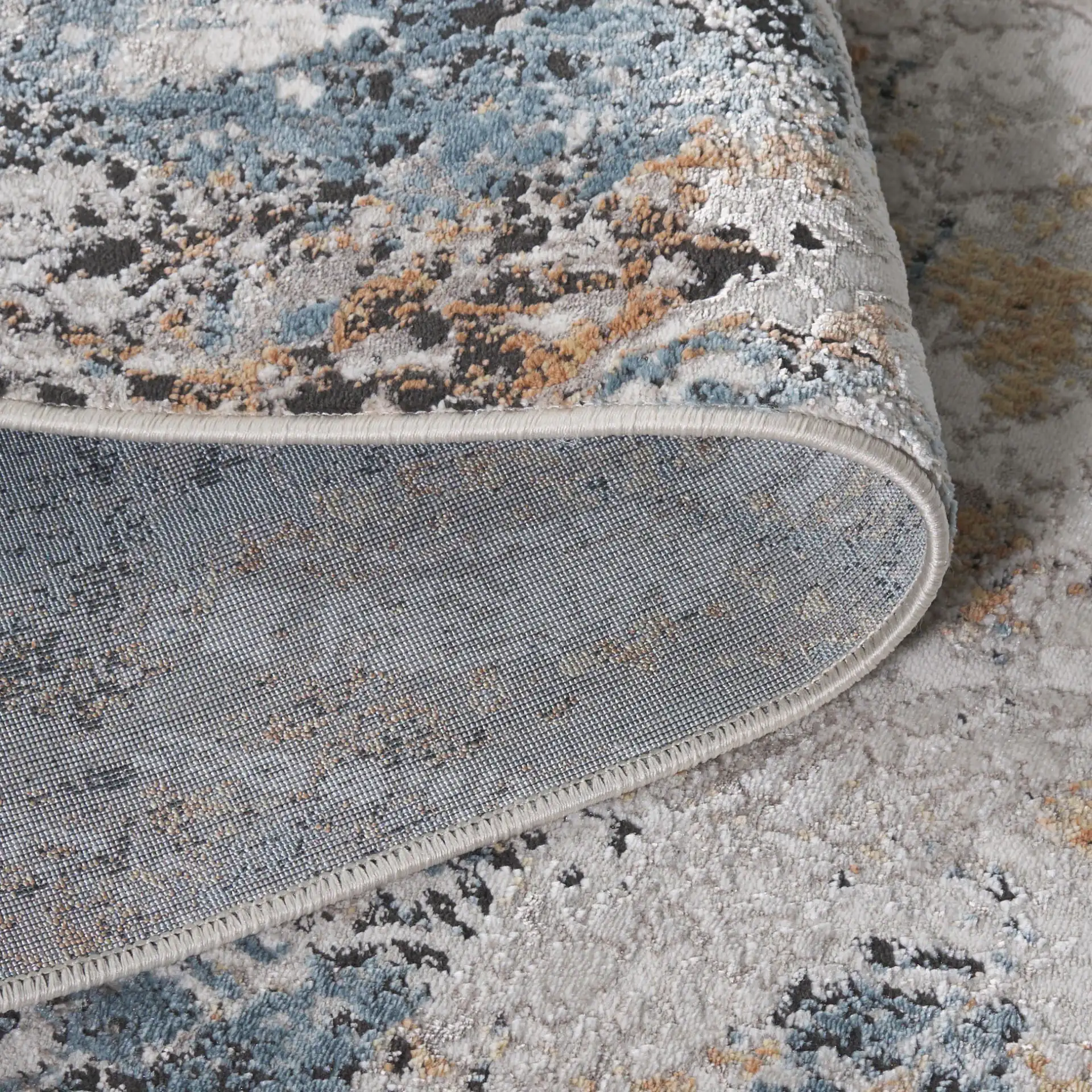 Rana Abstract Marble Rug in Ivory / Beige in a styled room