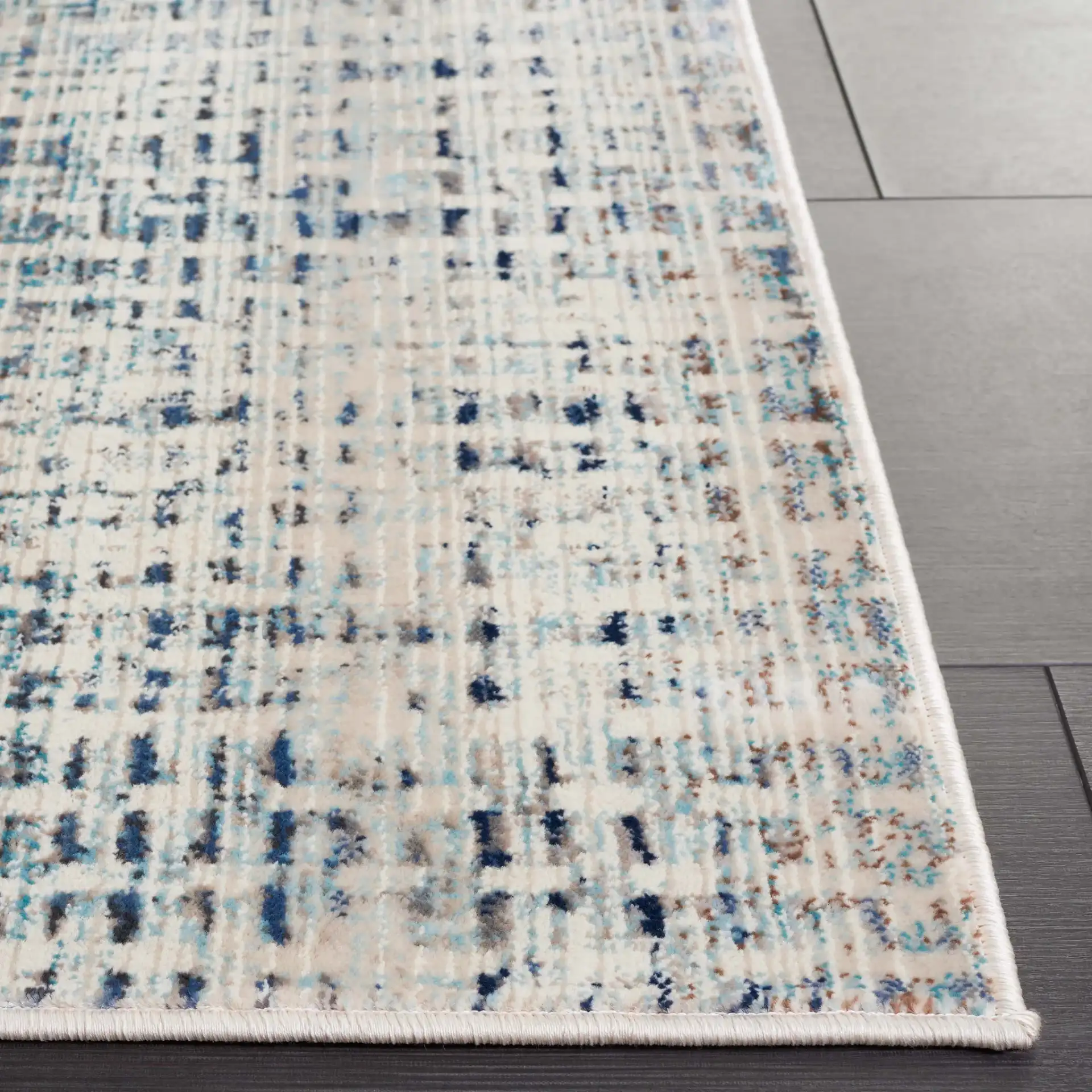 Rainbow Textured Grid Outdoor Rug in Blue / Ivory in a styled room