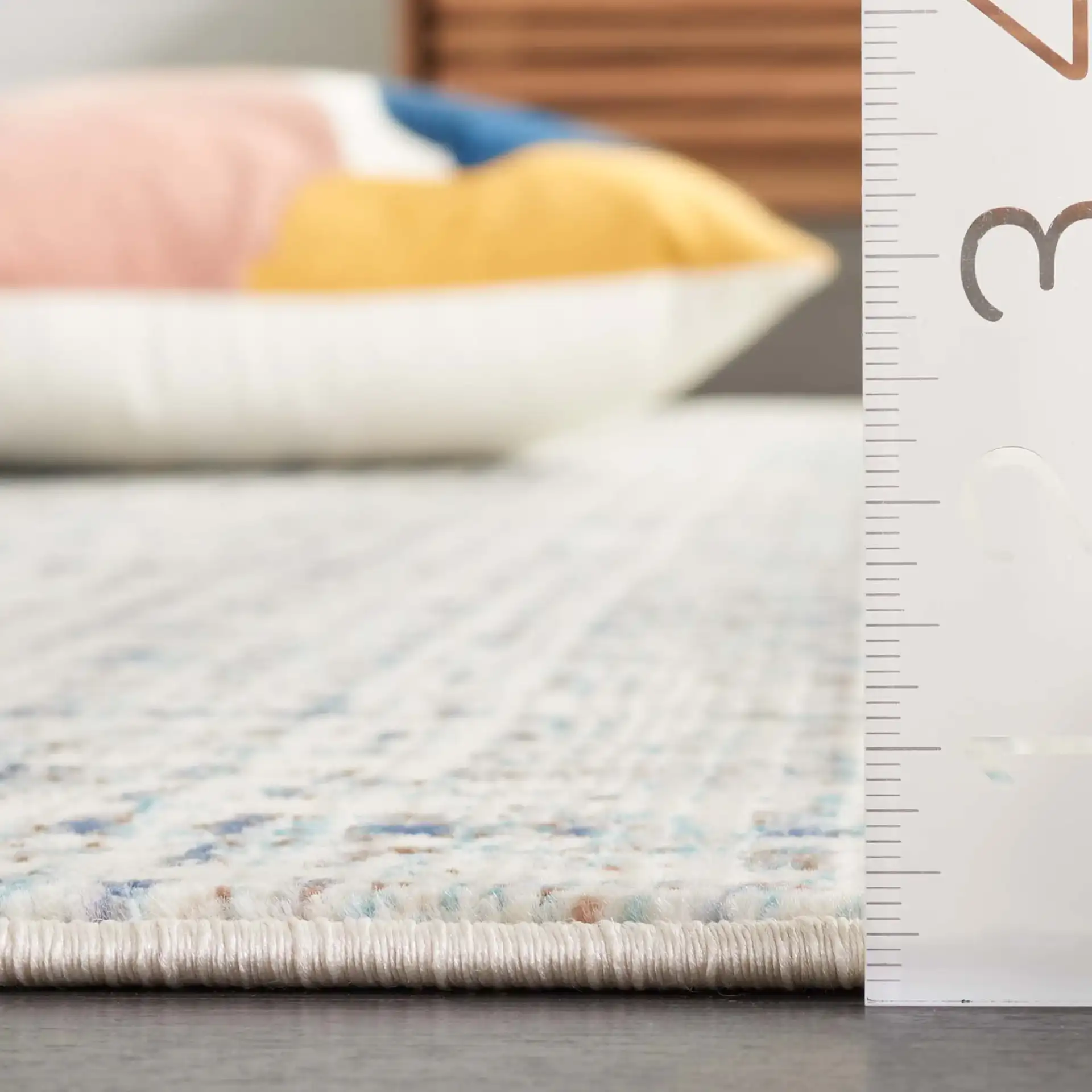 Rainbow Textured Grid Outdoor Rug in Blue / Ivory in a styled room