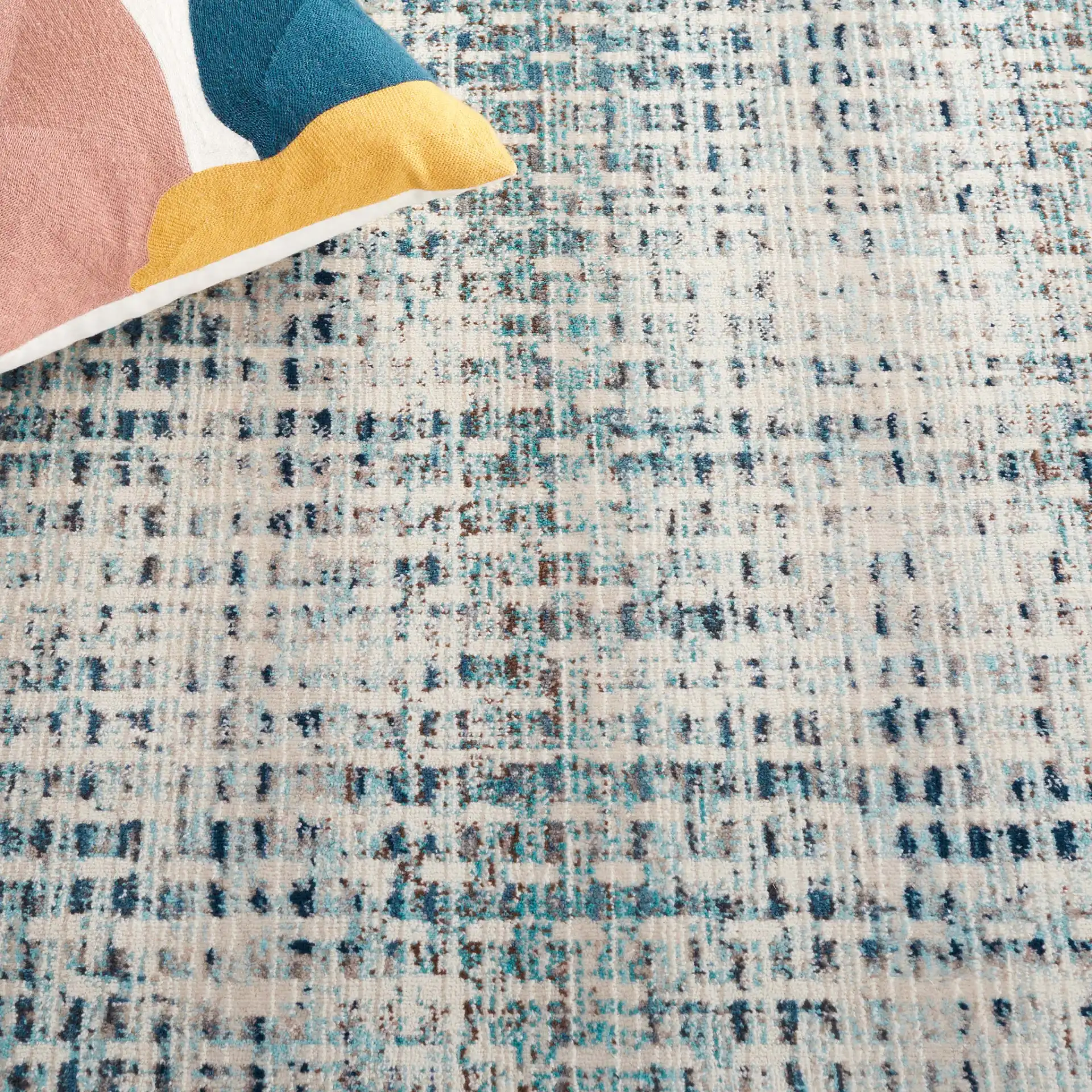 Rainbow Textured Grid Outdoor Rug in Blue / Ivory in a styled room