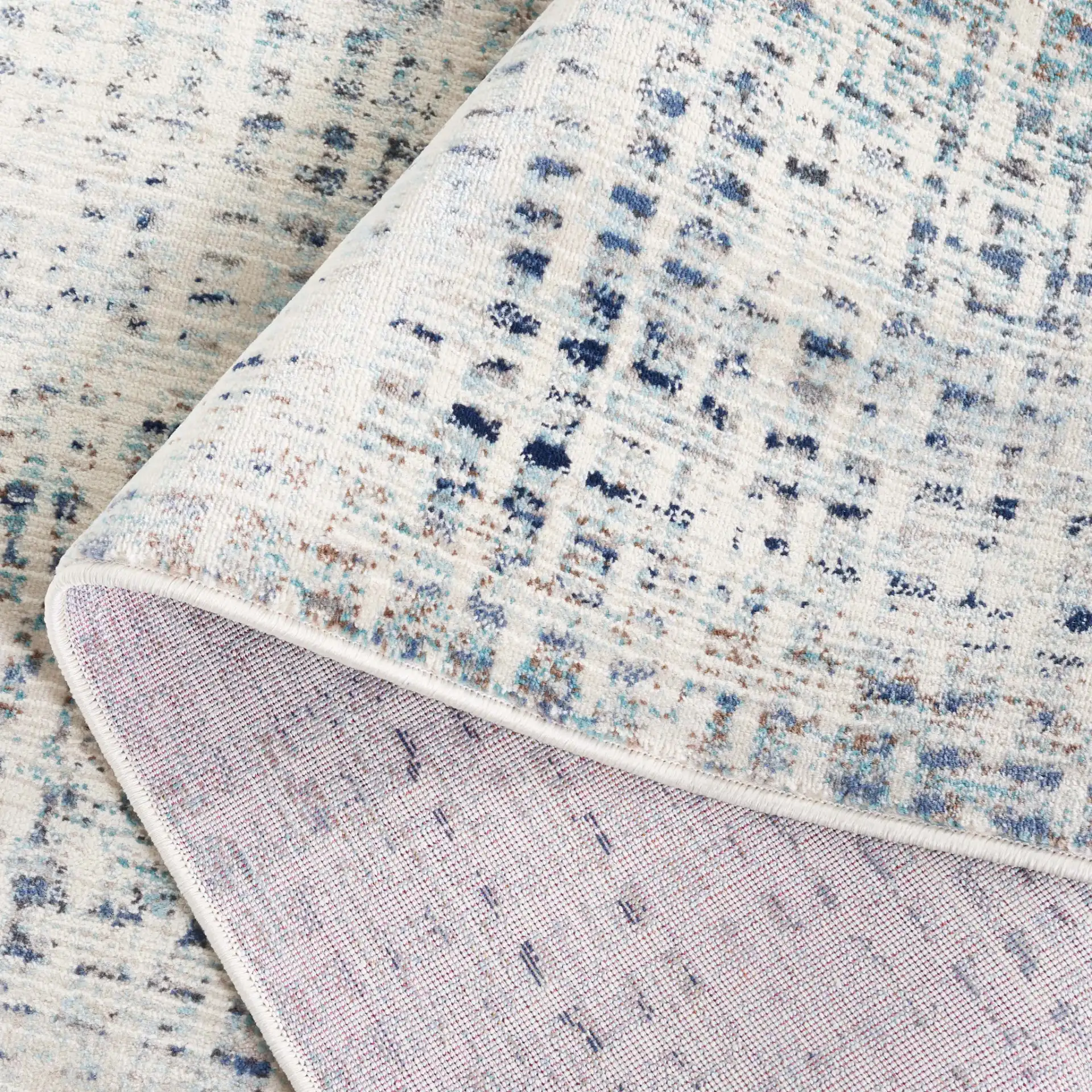 Rainbow Textured Grid Outdoor Rug in Blue / Ivory in a styled room