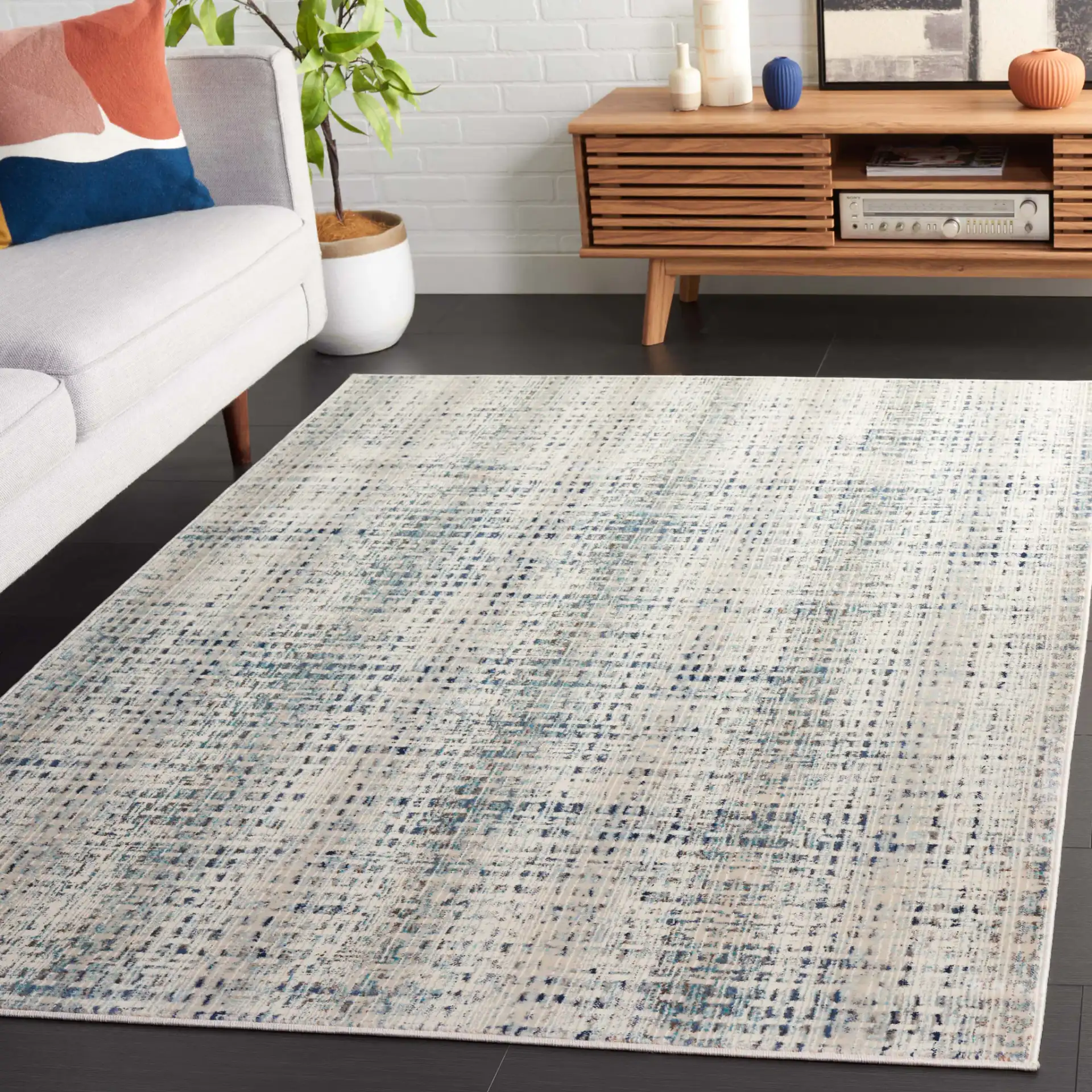 Rainbow Textured Grid Outdoor Rug in Blue / Ivory in a styled room