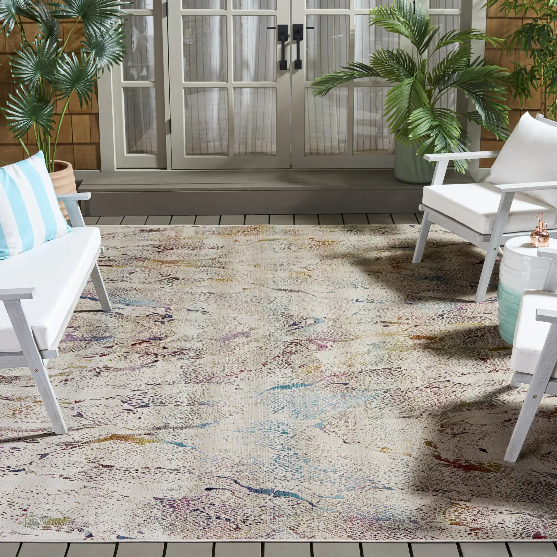 Rainbow Marbled Outdoor Rug in Ivory / Blue Gold in a styled room