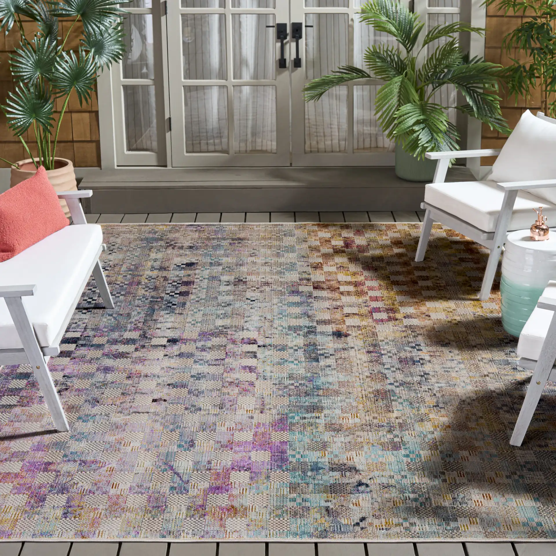 Rainbow Patchwork Grid Outdoor Rug in Blue / Gold in a styled room