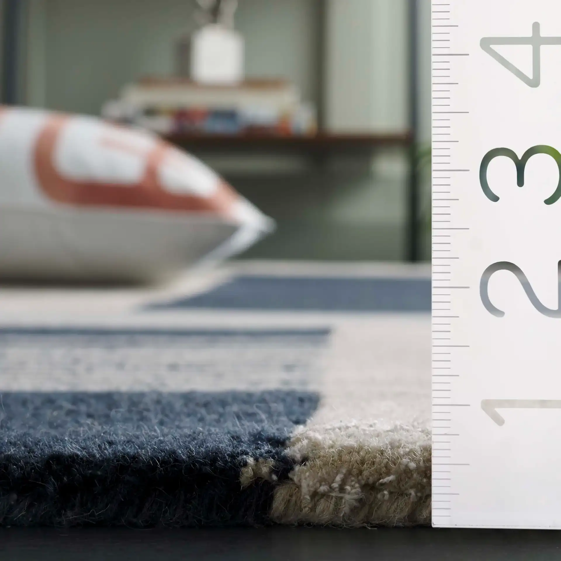Rodeo Drive Abstract Block Hand-Tufted Wool Rug in Navy / Ivory in a styled room