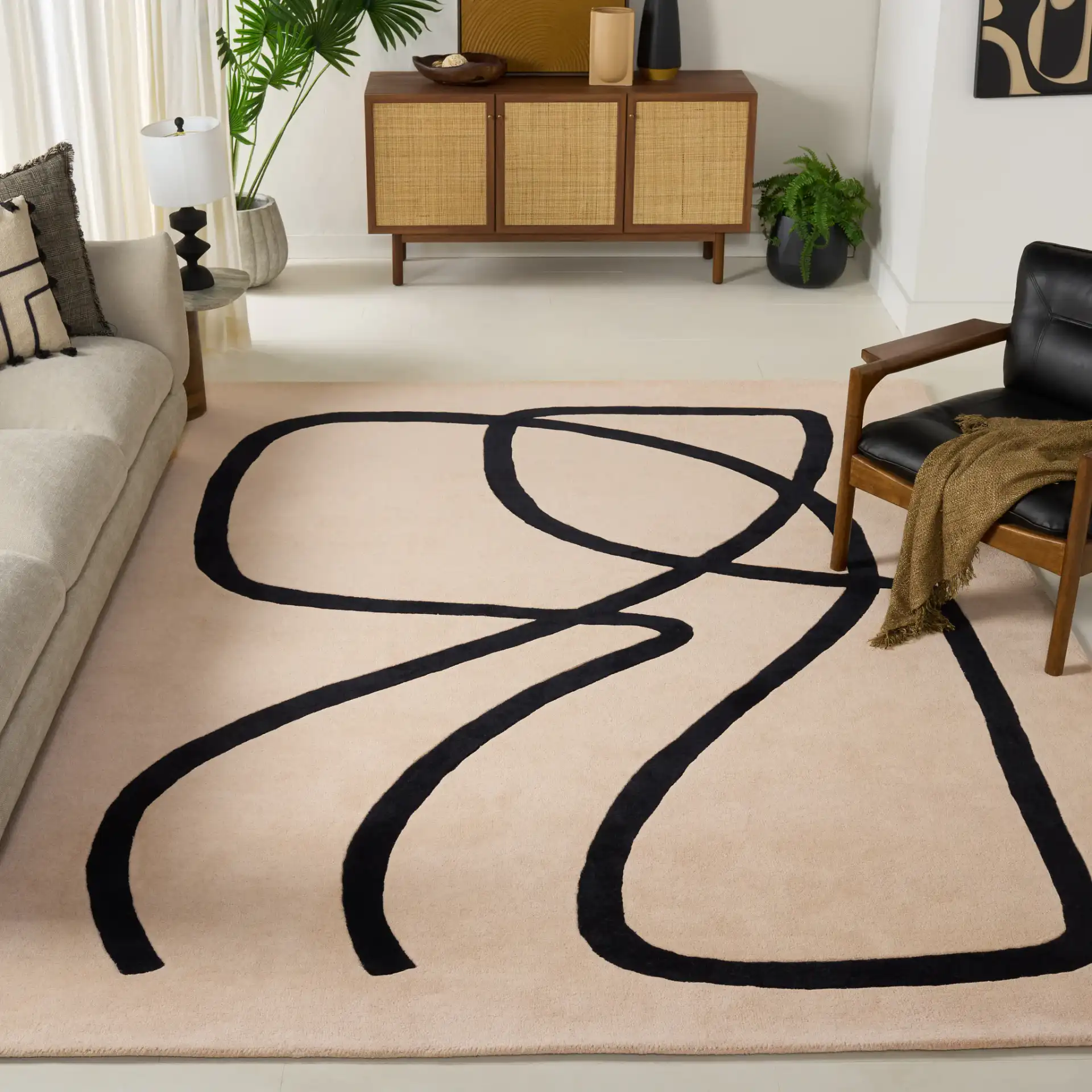 Rodeo Drive Abstract Loop Hand-Tufted Wool Rug in Ivory / Black in a styled room