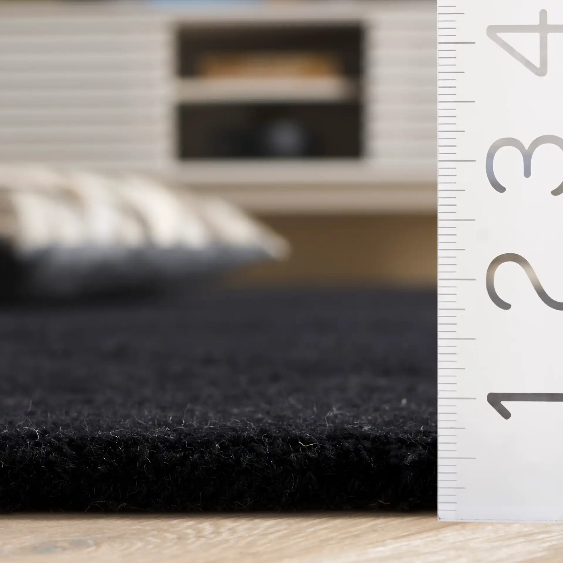 Rodeo Drive Carved Diamond Hand-Tufted Wool Rug in Black in a styled room