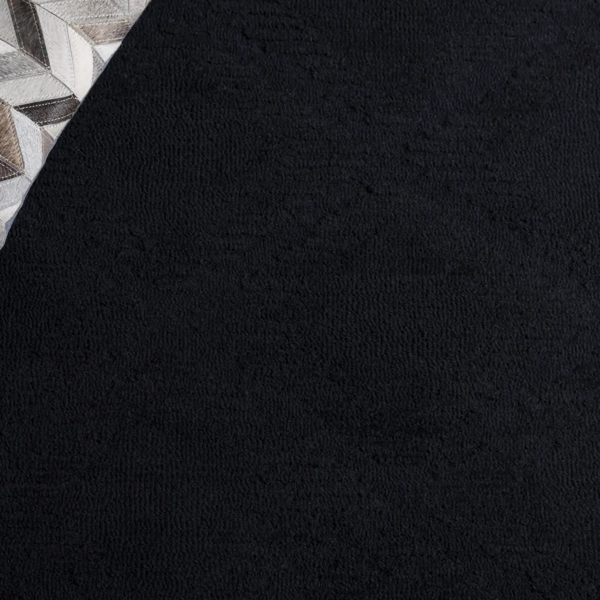 Rodeo Drive Carved Diamond Hand-Tufted Wool Rug in Black in a styled room