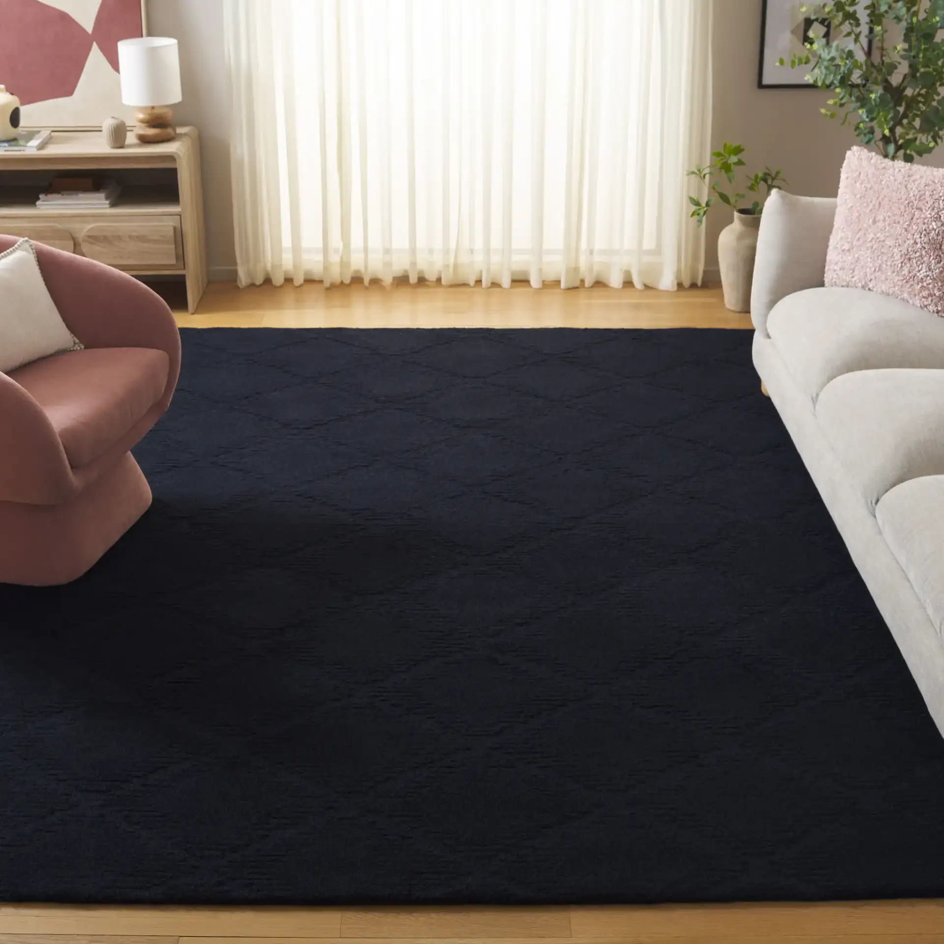 Rodeo Drive Carved Diamond Hand-Tufted Wool Rug in Black in a styled room