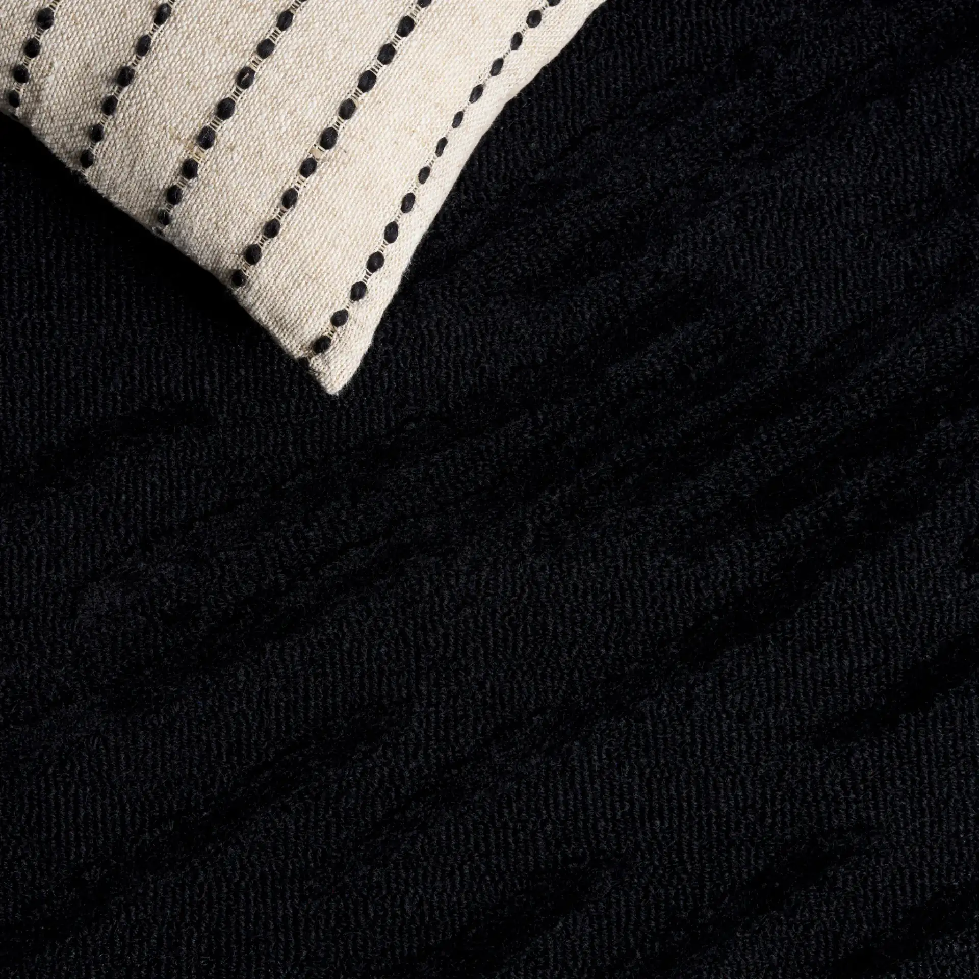 Rodeo Drive Diagonal Stripe Hand-Tufted Wool Rug in Black in a styled room