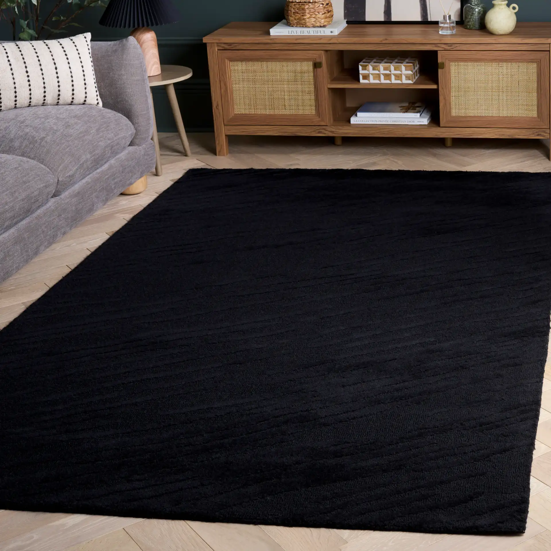 Rodeo Drive Diagonal Stripe Hand-Tufted Wool Rug in Black in a styled room