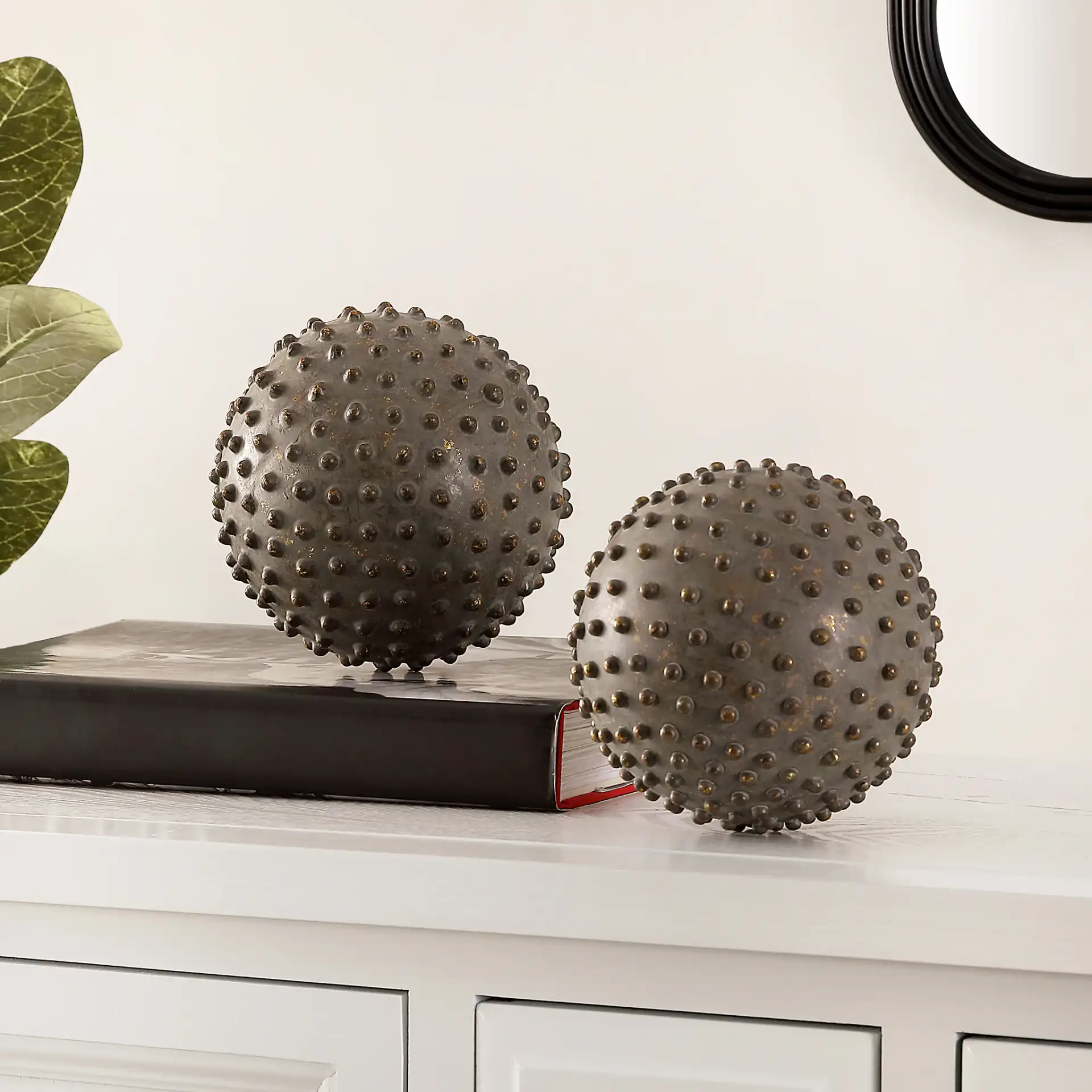 Roni Set Of Two Decorative Balls in Brown in a styled room