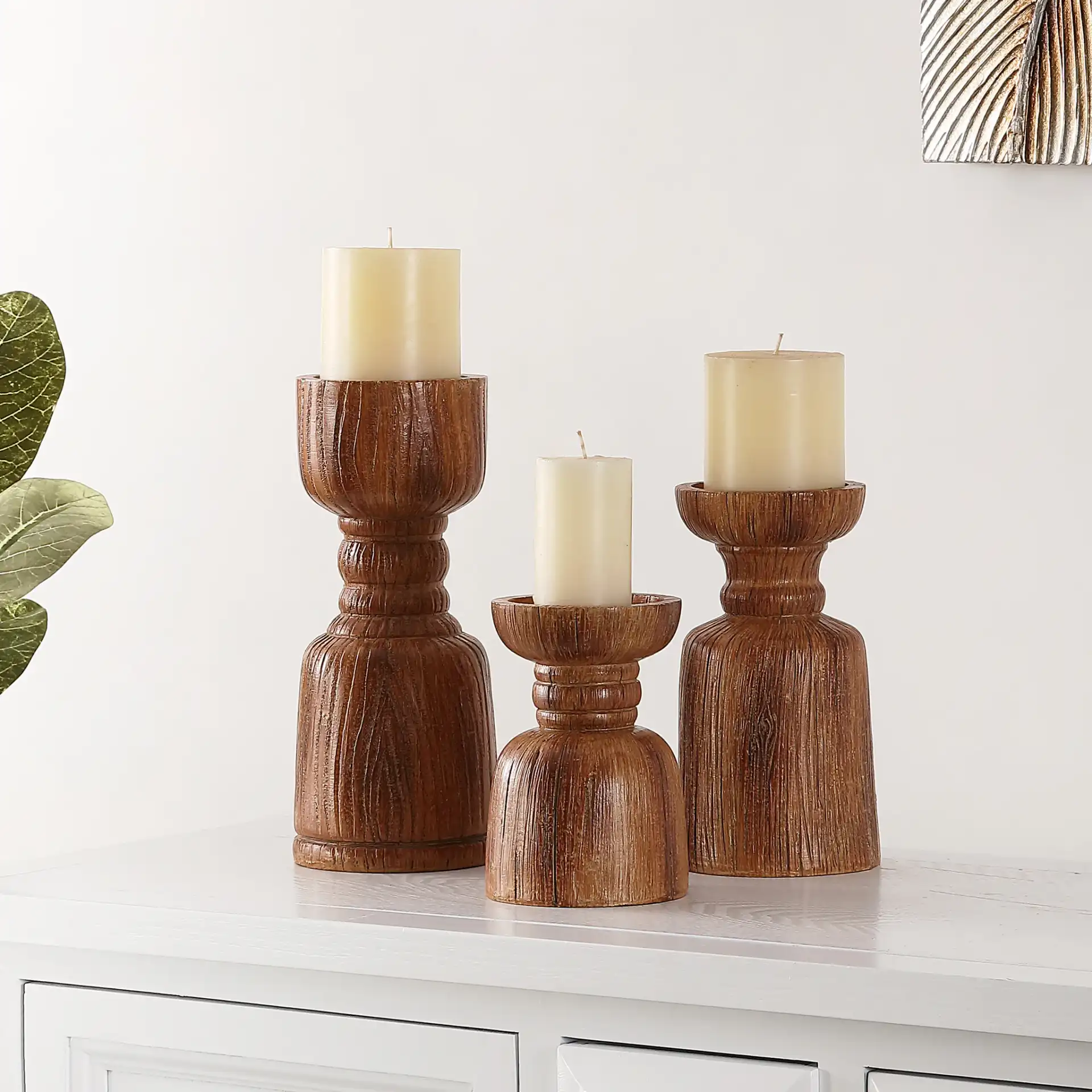 Lia Three-Piece Candle Holder Set in Brown in a styled room