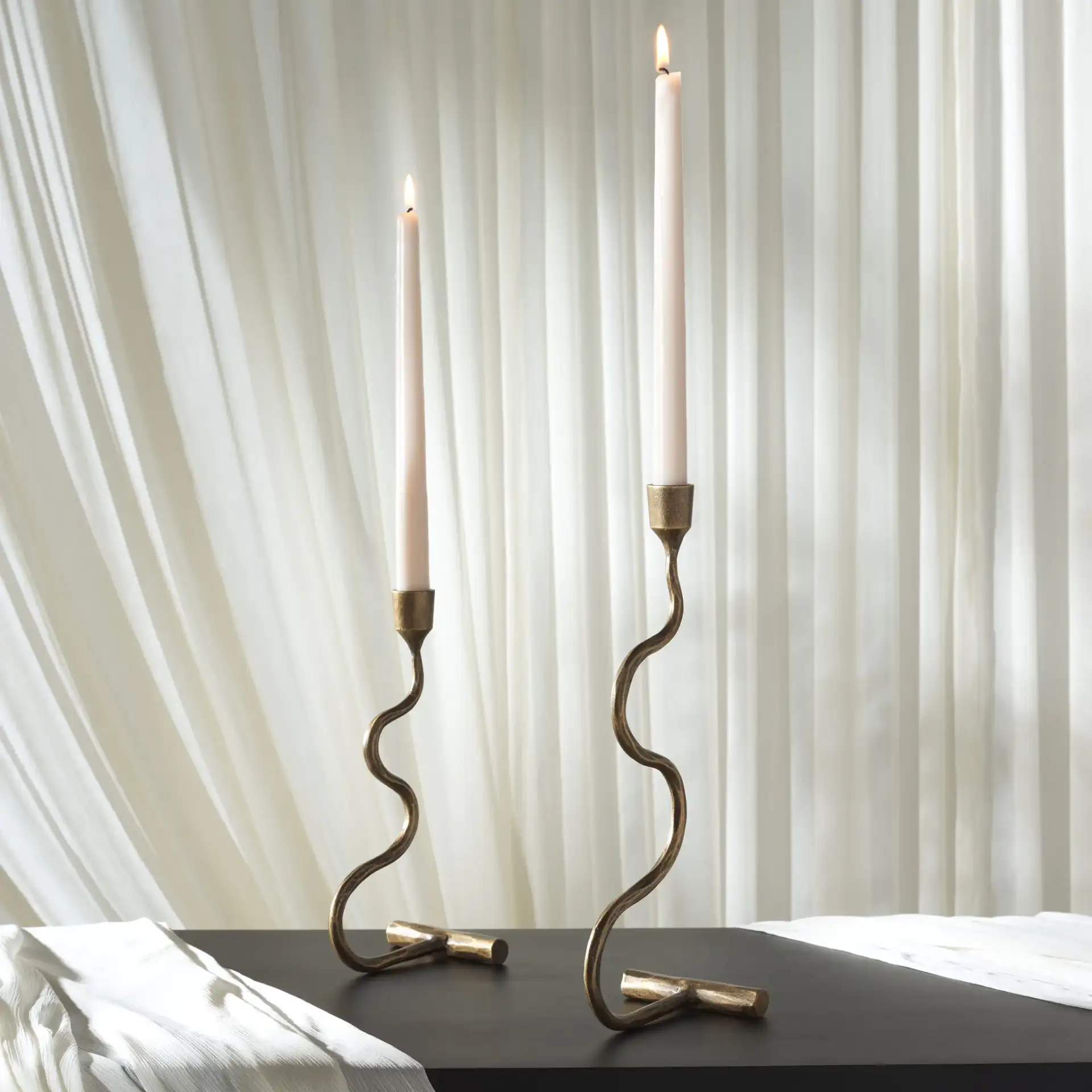 Zobi Candlestick (Set Of 2) in Gold in a styled room