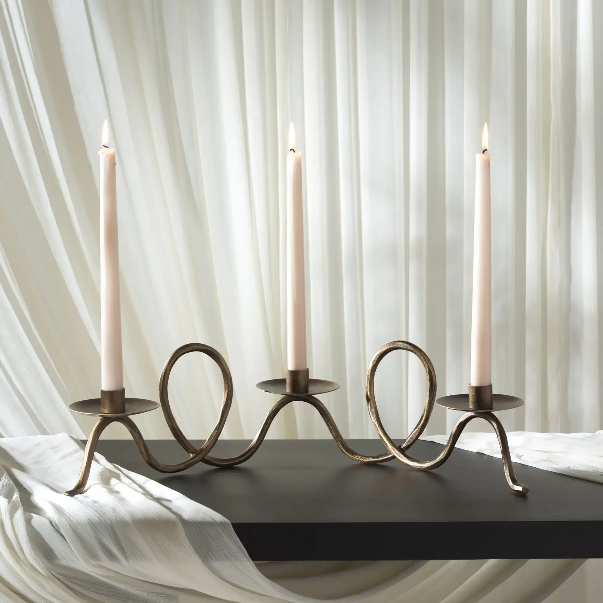 Cian Candle Centerpiece in Brass in a styled room