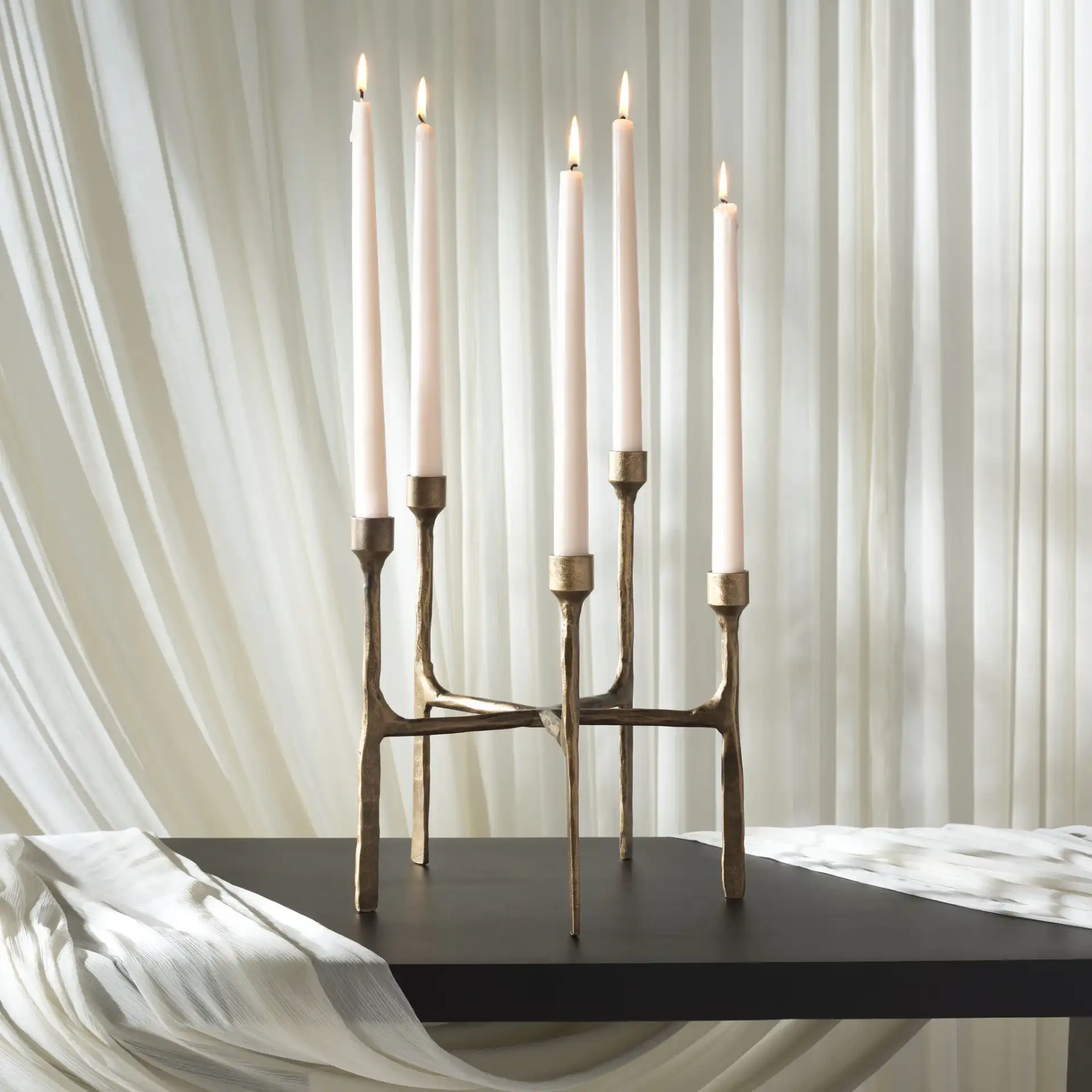 Quyn Candle Centerpiece in Brass in a styled room
