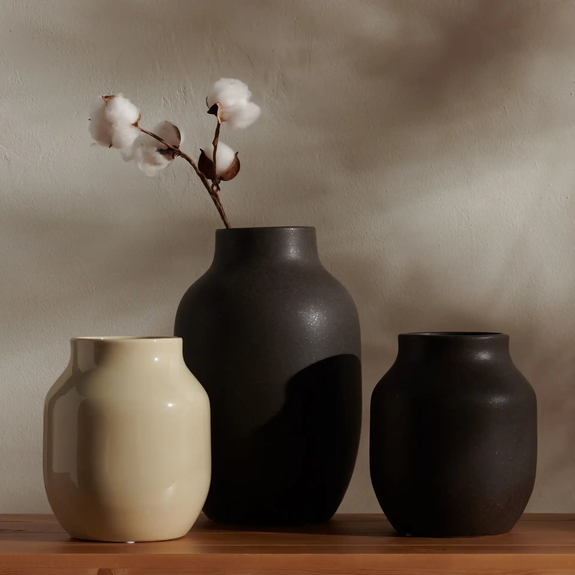 Raya Ceramic Vase (Set Of 3) in Charcoal / Beige in a styled room