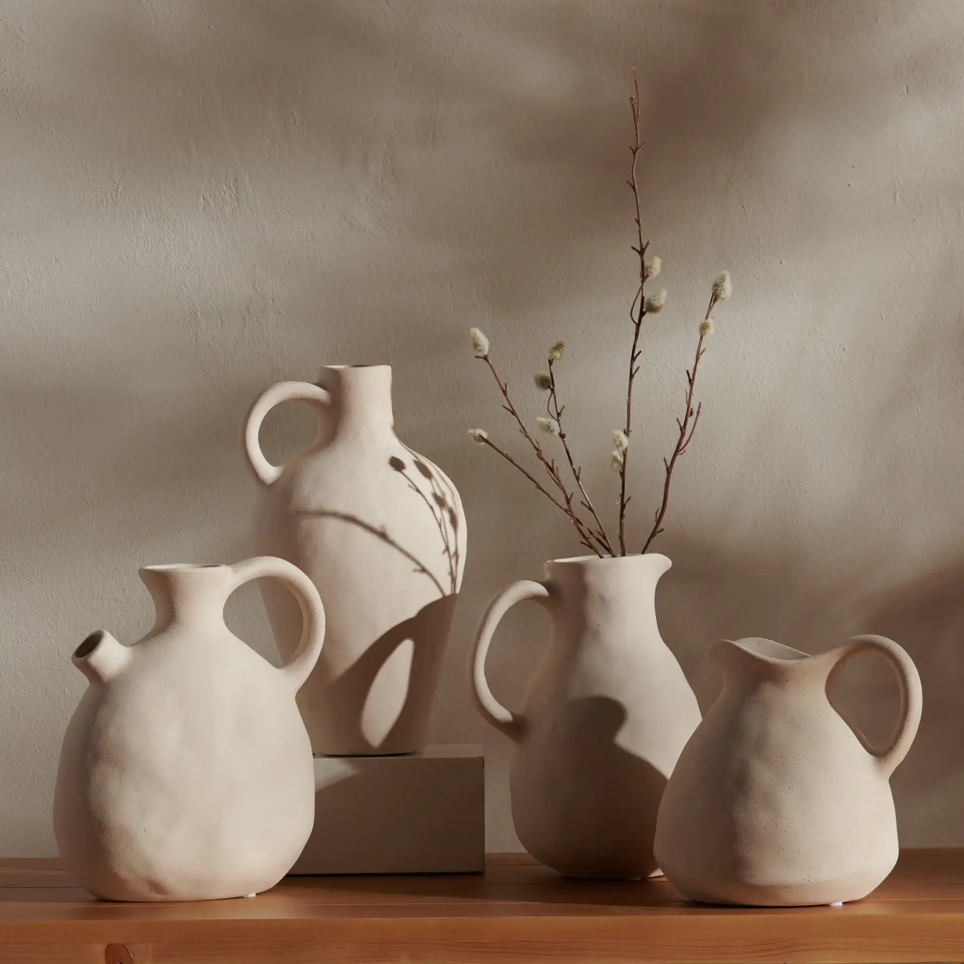 Misa Ceramic Vase (Set Of 4) in Beige in a styled room