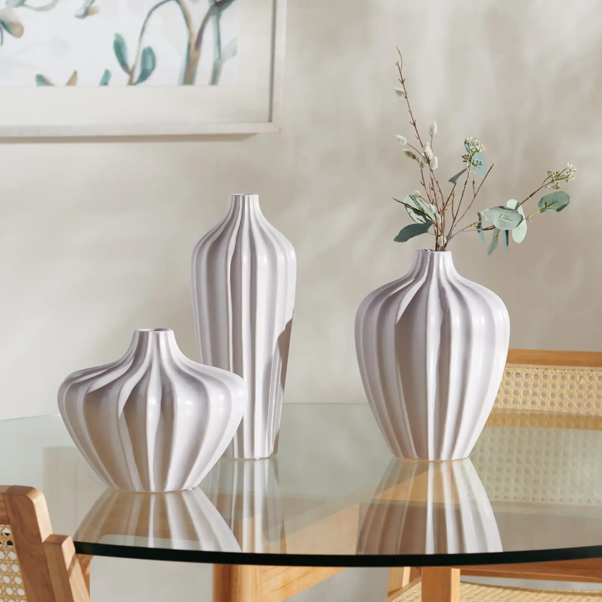 Clea Ceramic Vase (Set Of 3) in Ivory in a styled room