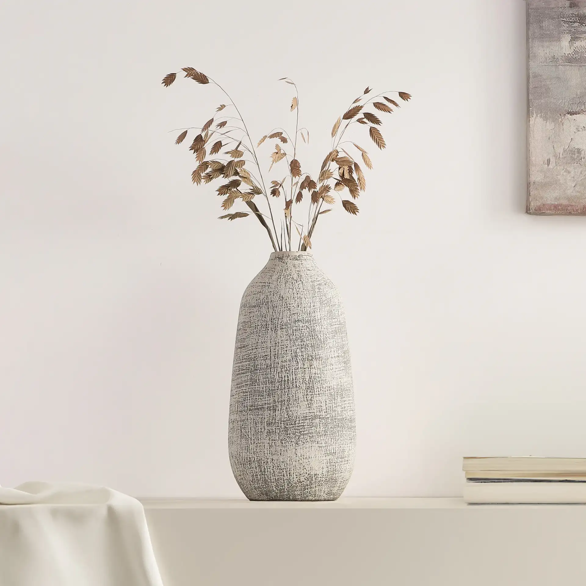 Oia 10.75-Inch Ceramic Vase in Gray / White Wash in a styled room