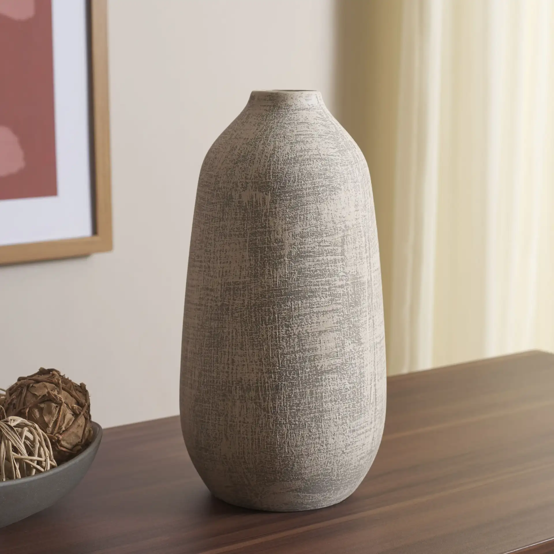 Oia 10.75-Inch Ceramic Vase in Gray / White Wash in a styled room