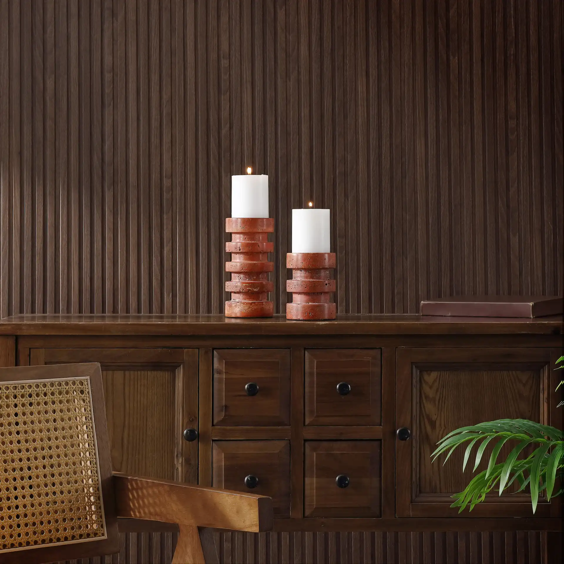 Capri Candle Holder (Set Of 2) in Orange / Rust in a styled room