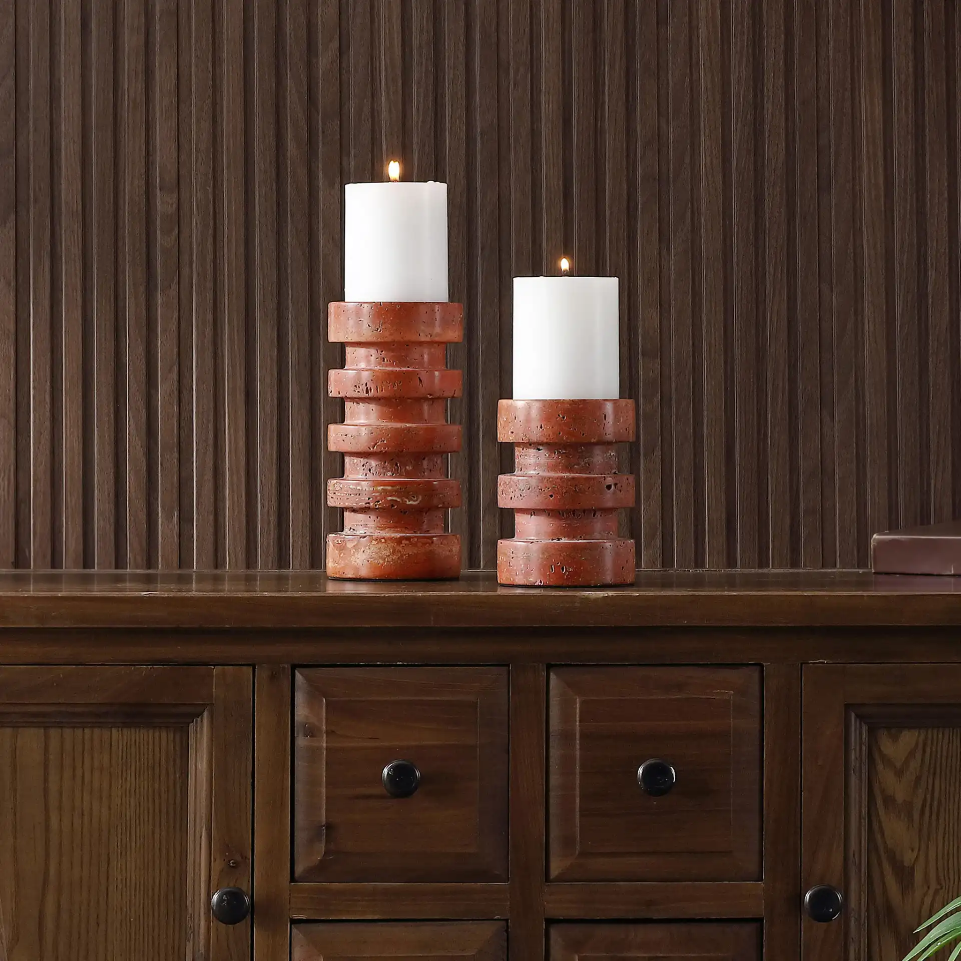 Capri Candle Holder (Set Of 2) in Orange / Rust in a styled room