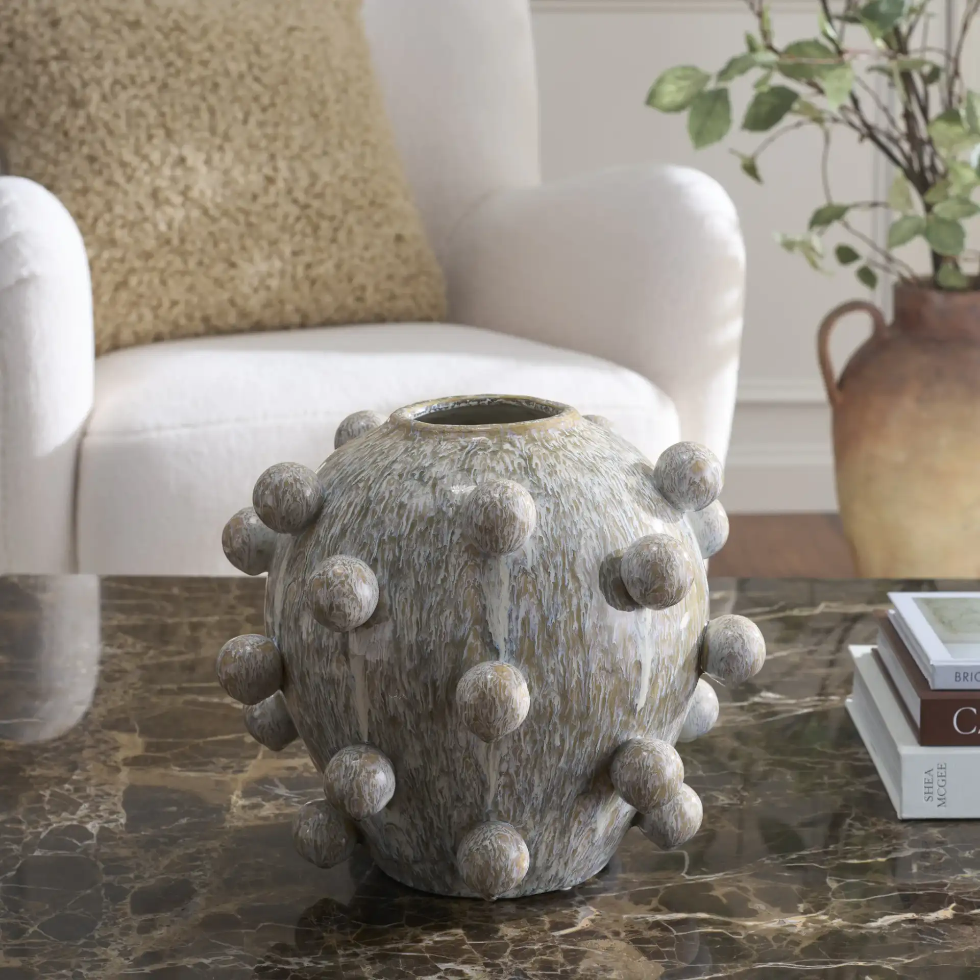 Clio 12 Orb Reactive Ceramic Vase in Off White / Gray in a styled room