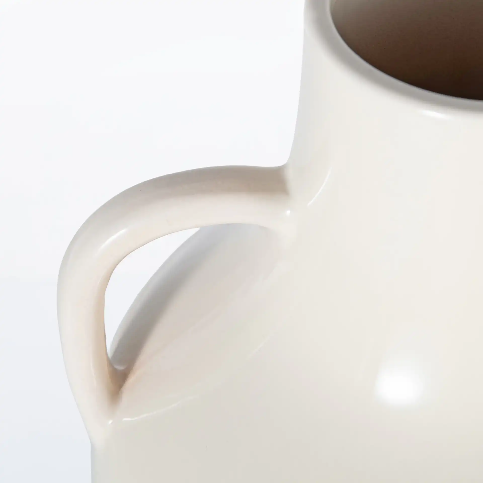 Athena 18-Inch Ceramic Handle Vase in Ivory / Light Brown in a styled room