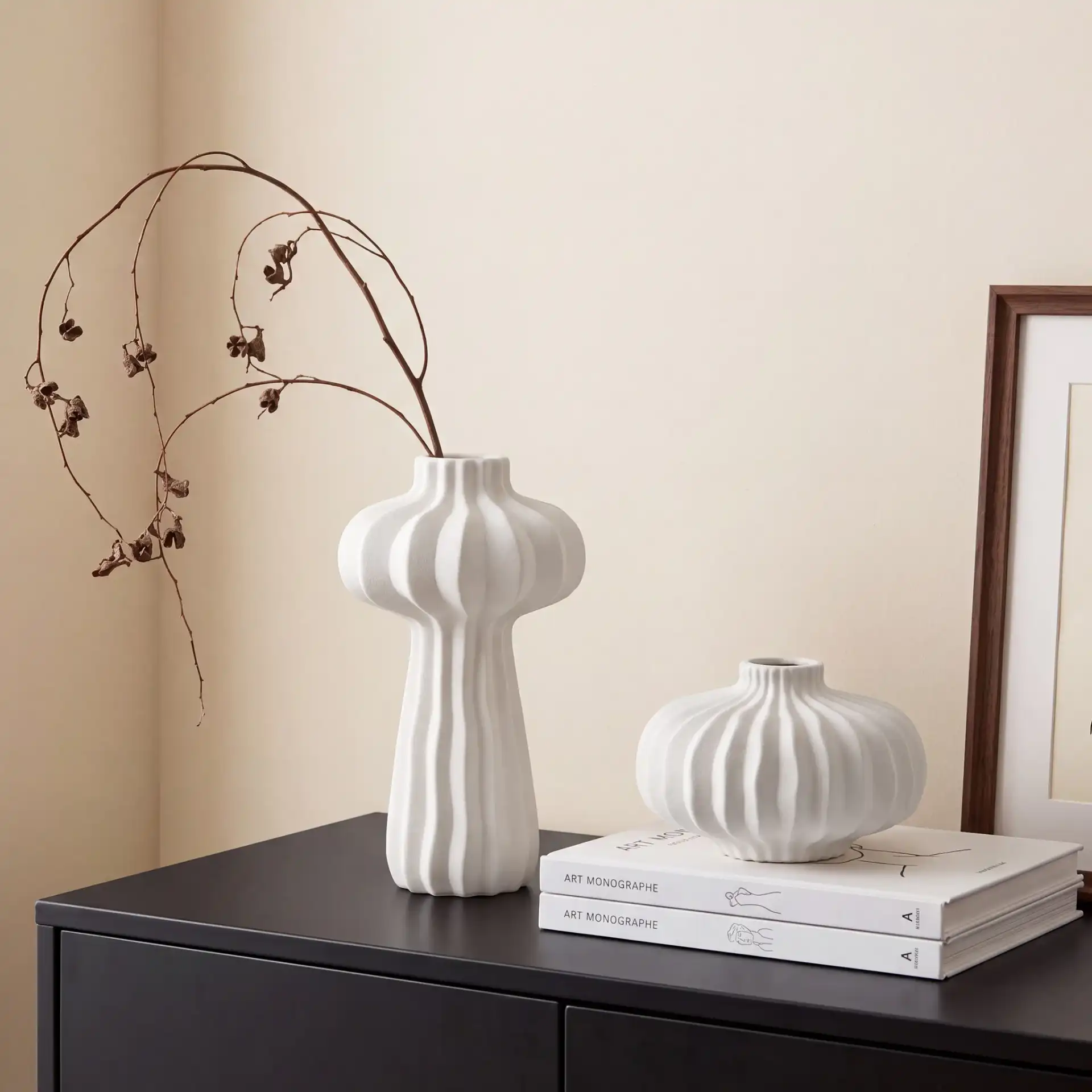 Frola Ribbed Vase ( Set Of 2 ) in Off White in a styled room