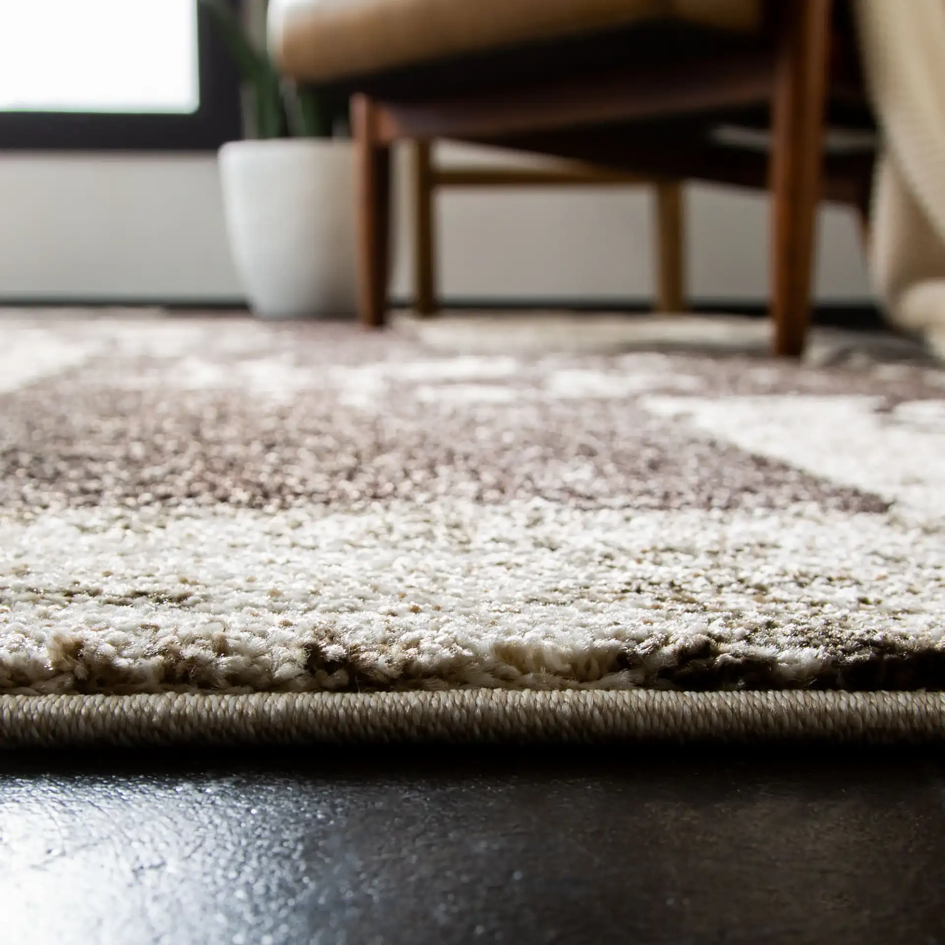 Retro Modern Patchwork Geometric Rug in Cream / Brown in a styled room