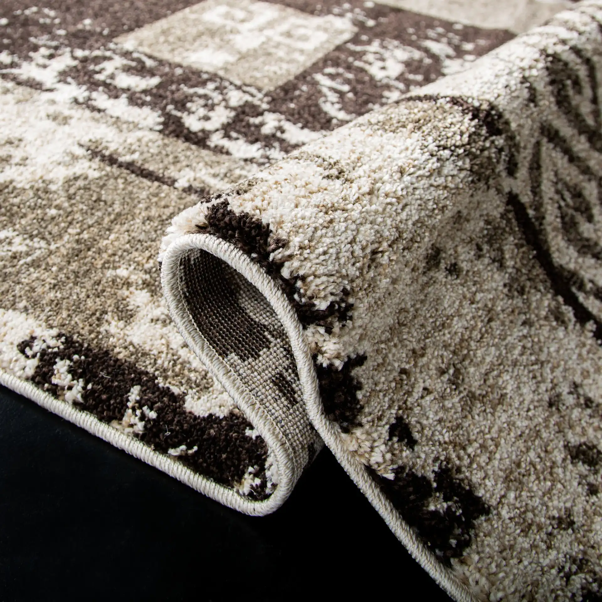 Retro Modern Patchwork Geometric Rug in Cream / Brown in a styled room