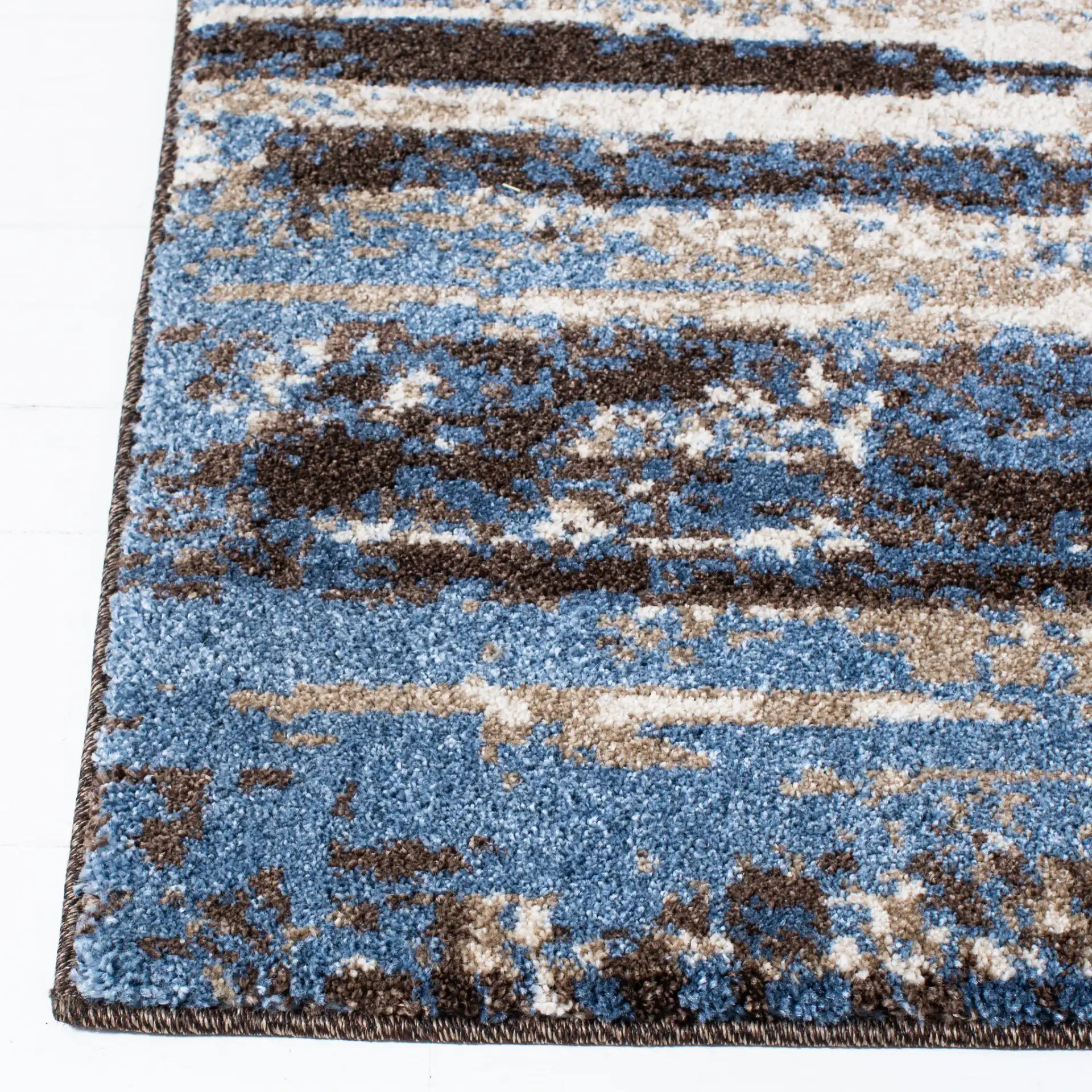 Retro Abstract Stripe Rug in Cream / Blue in a styled room