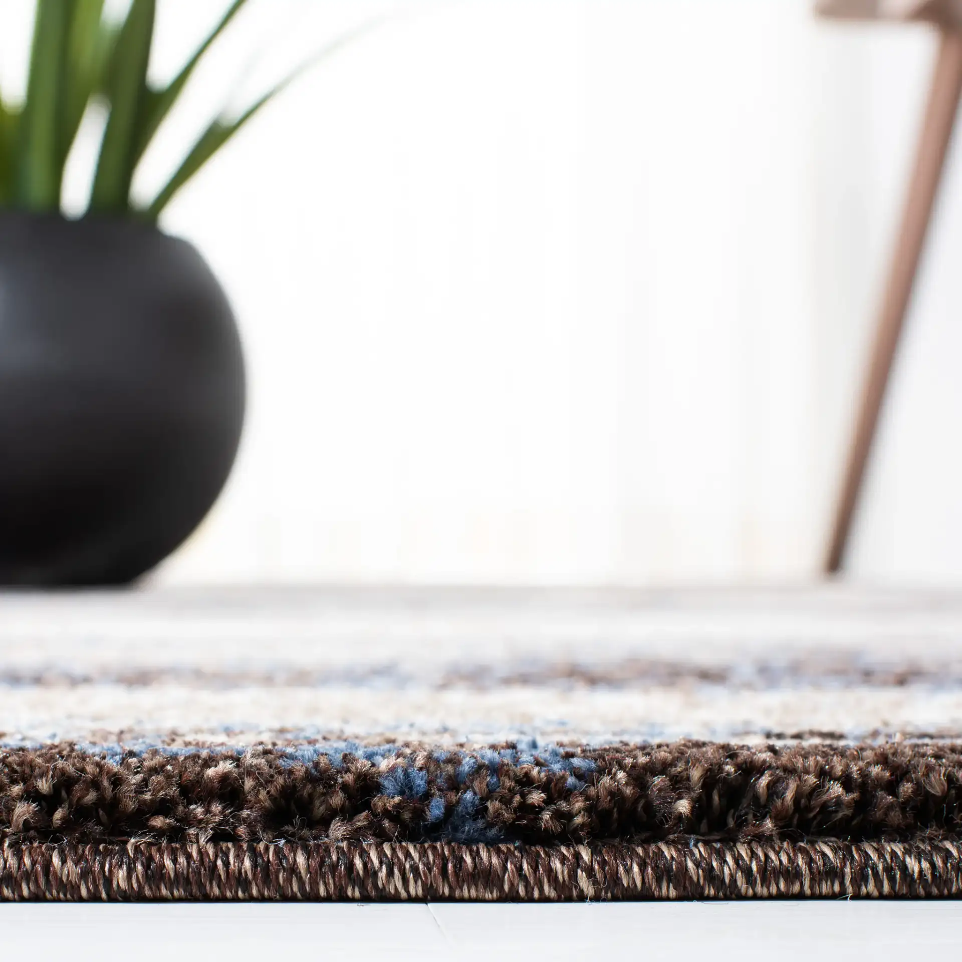 Retro Abstract Stripe Rug in Cream / Blue in a styled room
