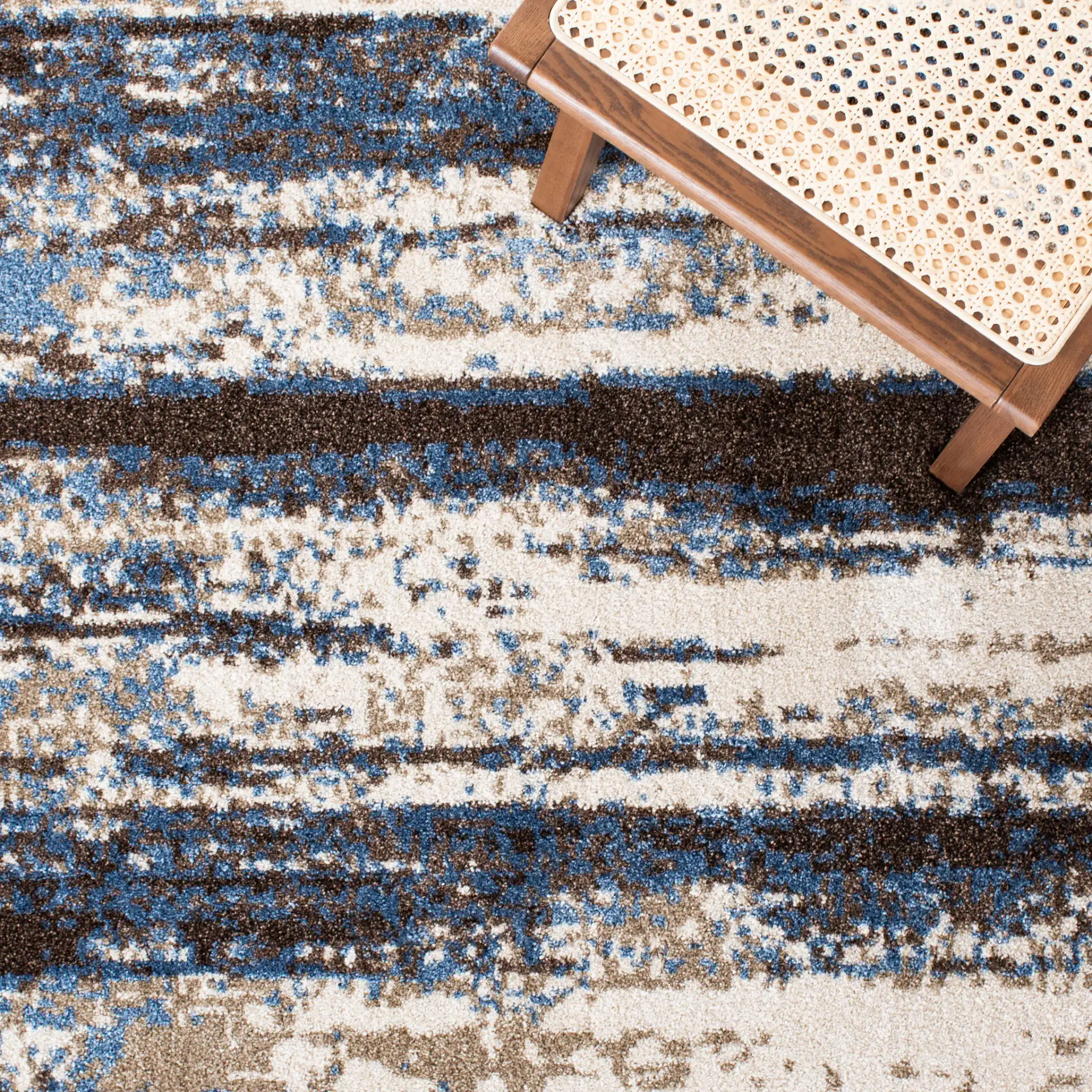 Retro Abstract Stripe Rug in Cream / Blue in a styled room