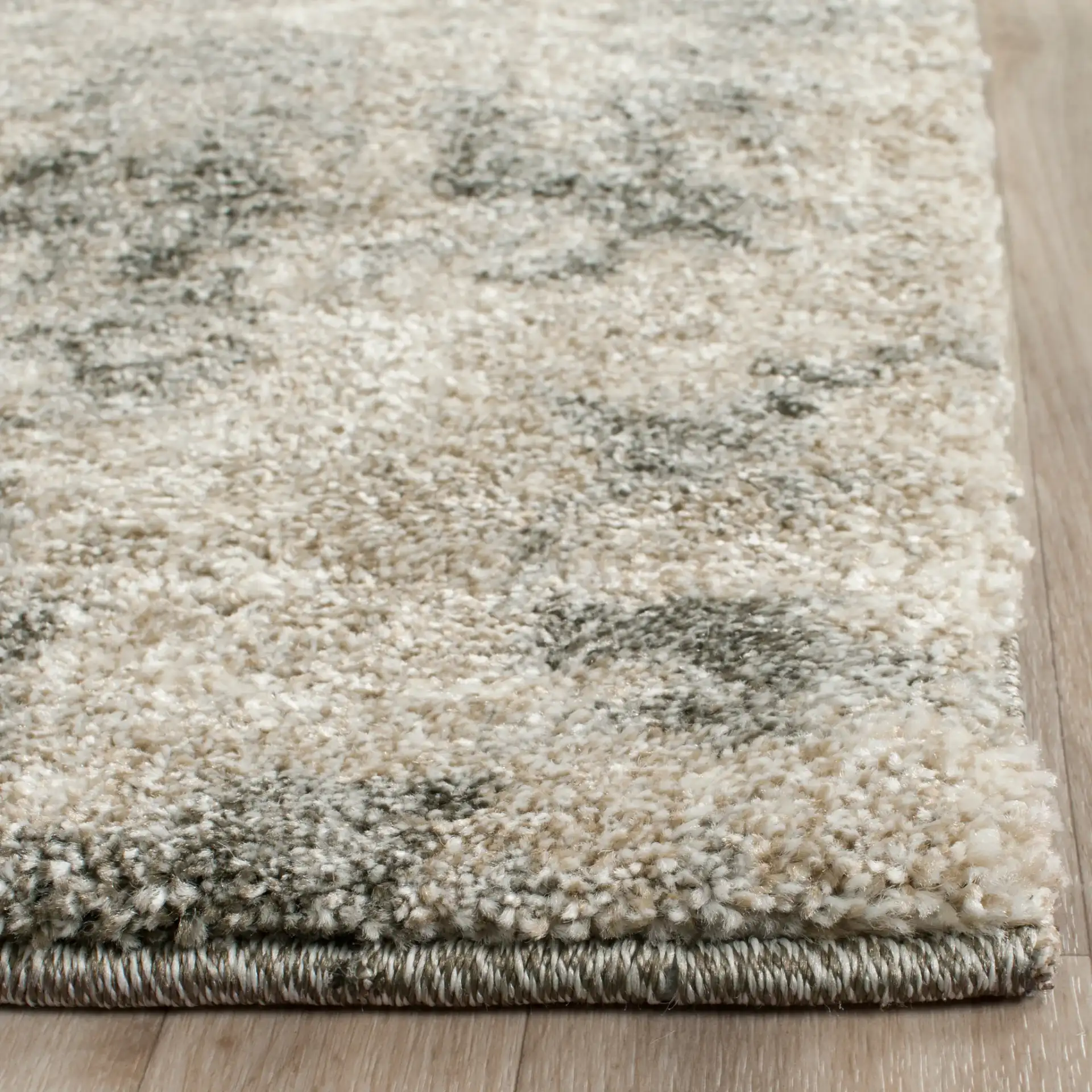 Retro Modern Distressed Damask Rug in Light Gray / Gray in a styled room