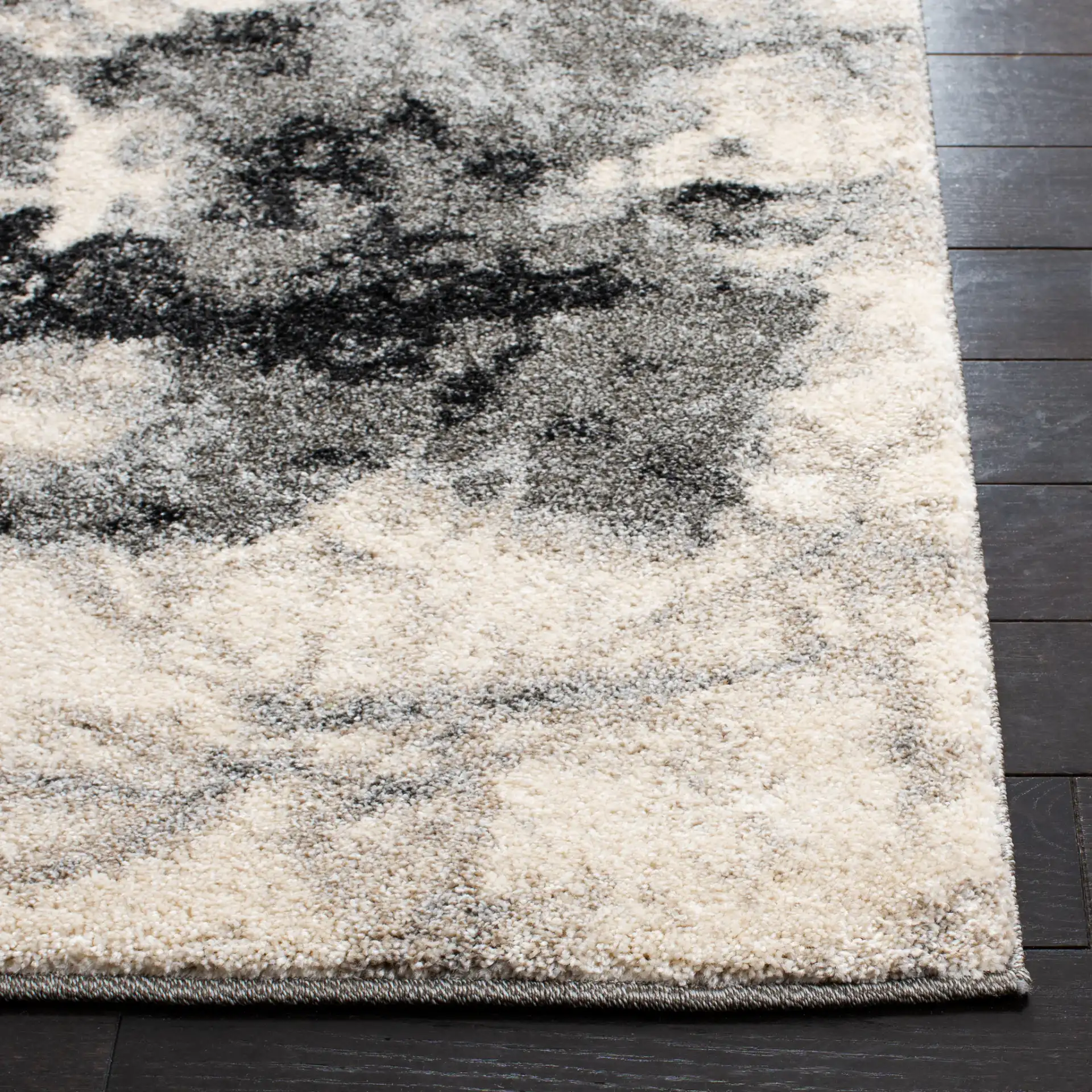 Retro Modern Splatter Abstract Rug in Cream / Gray in a styled room