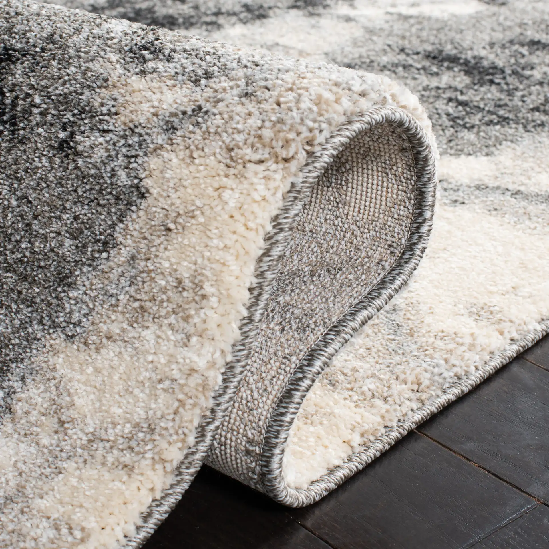 Retro Modern Splatter Abstract Rug in Cream / Gray in a styled room