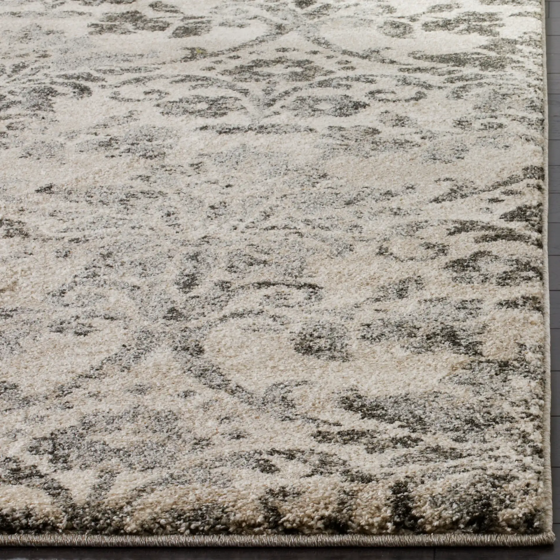 Retro Damask Rug in Cream / Gray in a styled room
