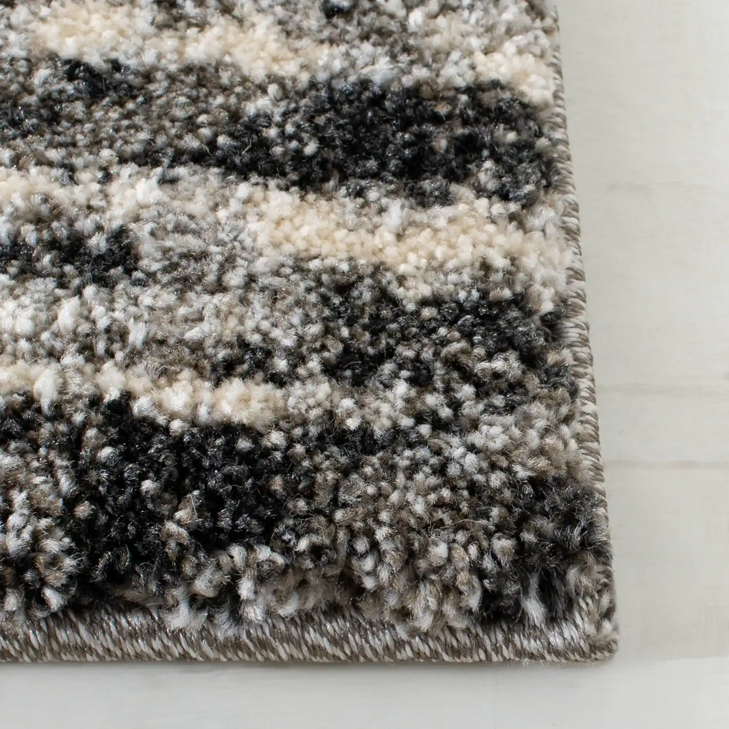 Retro Modern Striped Rug in Dark Gray / Light Gray in a styled room